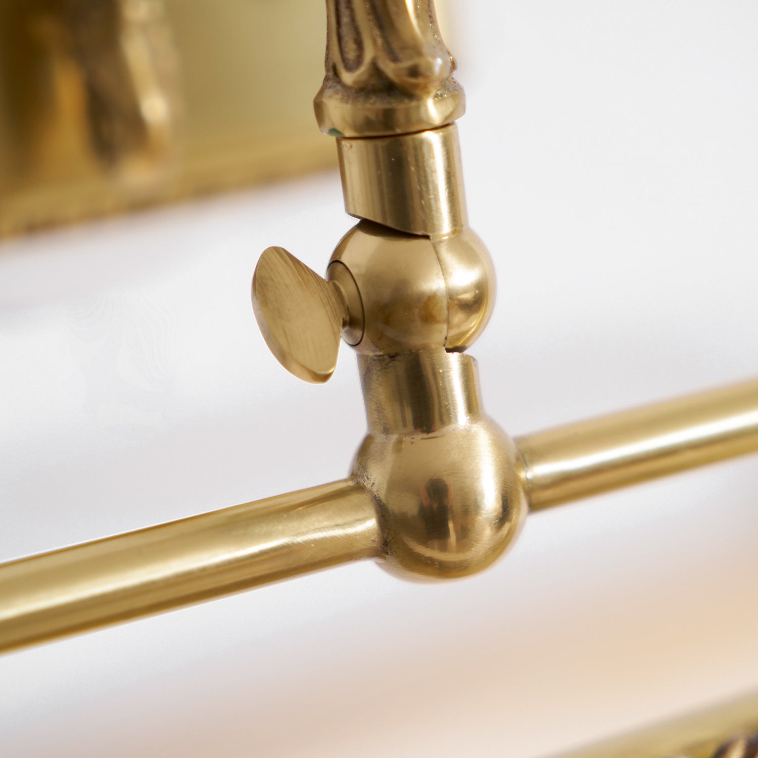 Close-up of the antique brass finish on the Pania Wall Lamp.