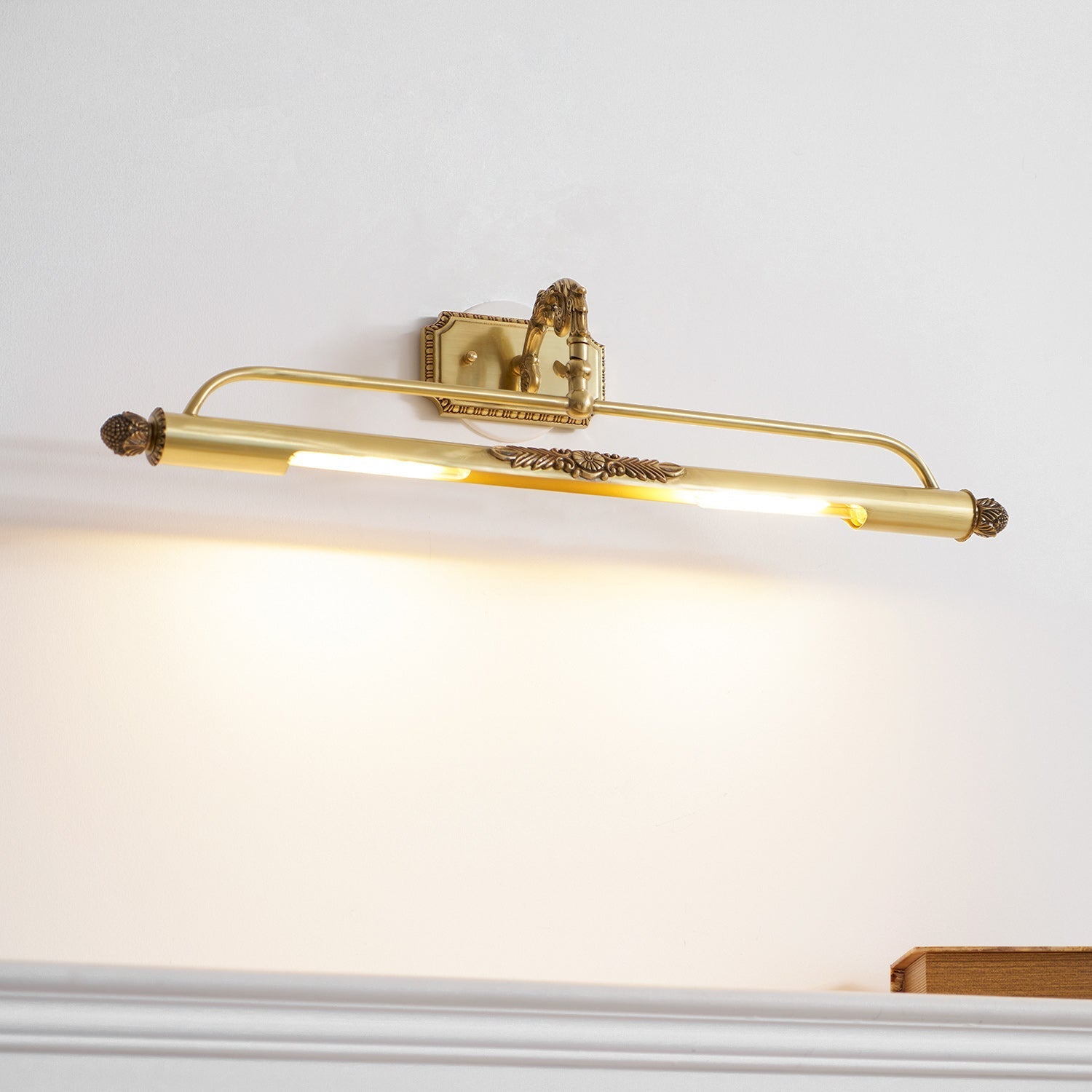 Pania Picture Light in a bedroom setting above a headboard.