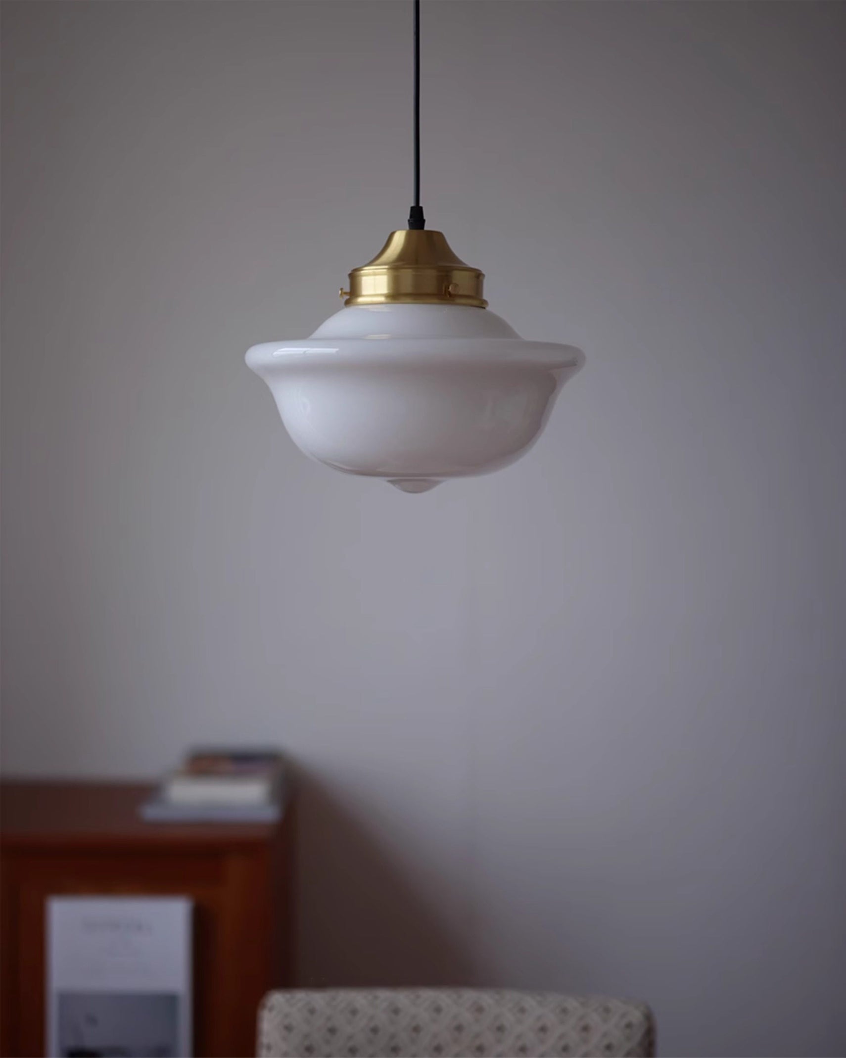The Pathson Pendant Light illuminated, casting a warm glow.