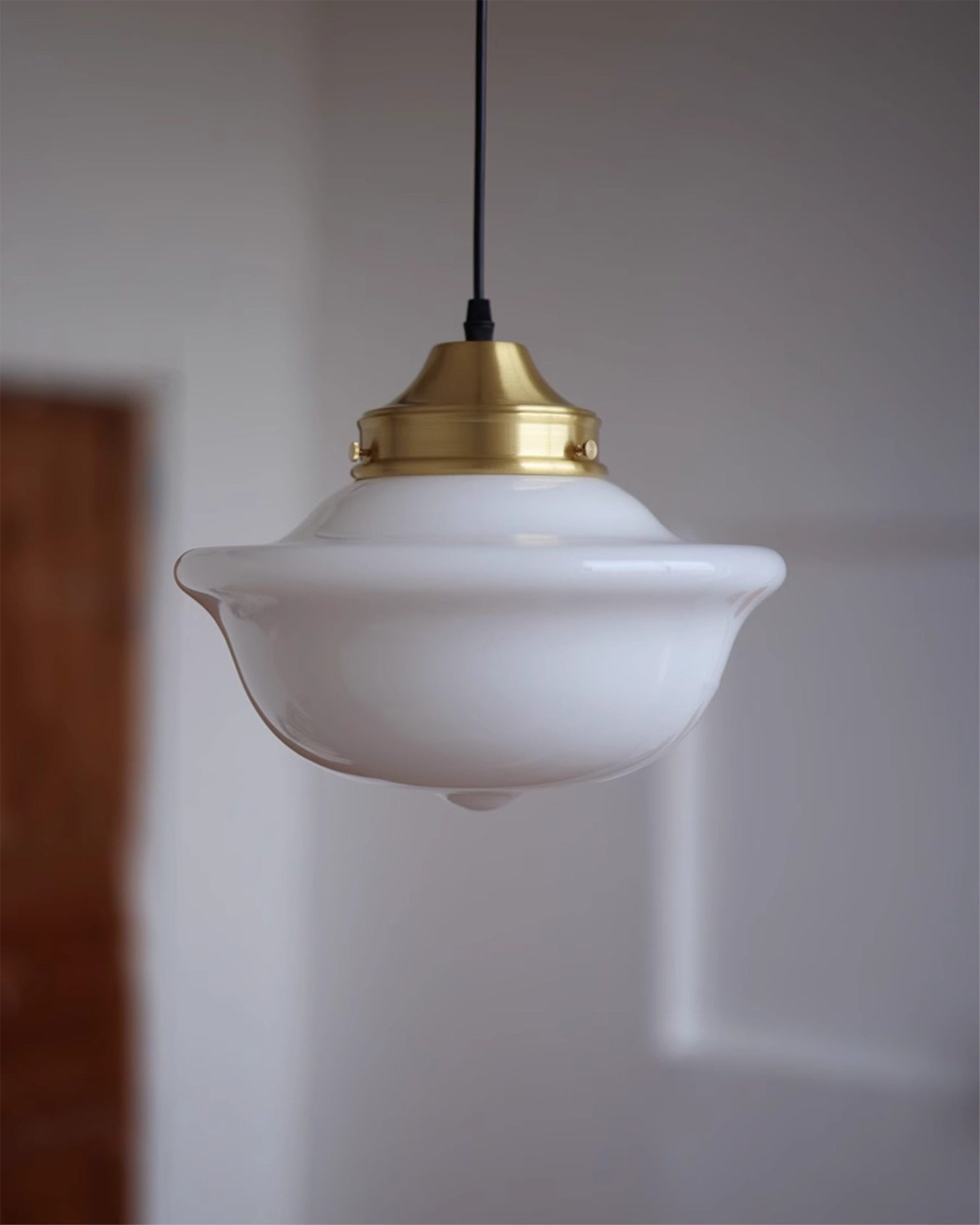 A row of Pathson Pendant Lights over a kitchen island.