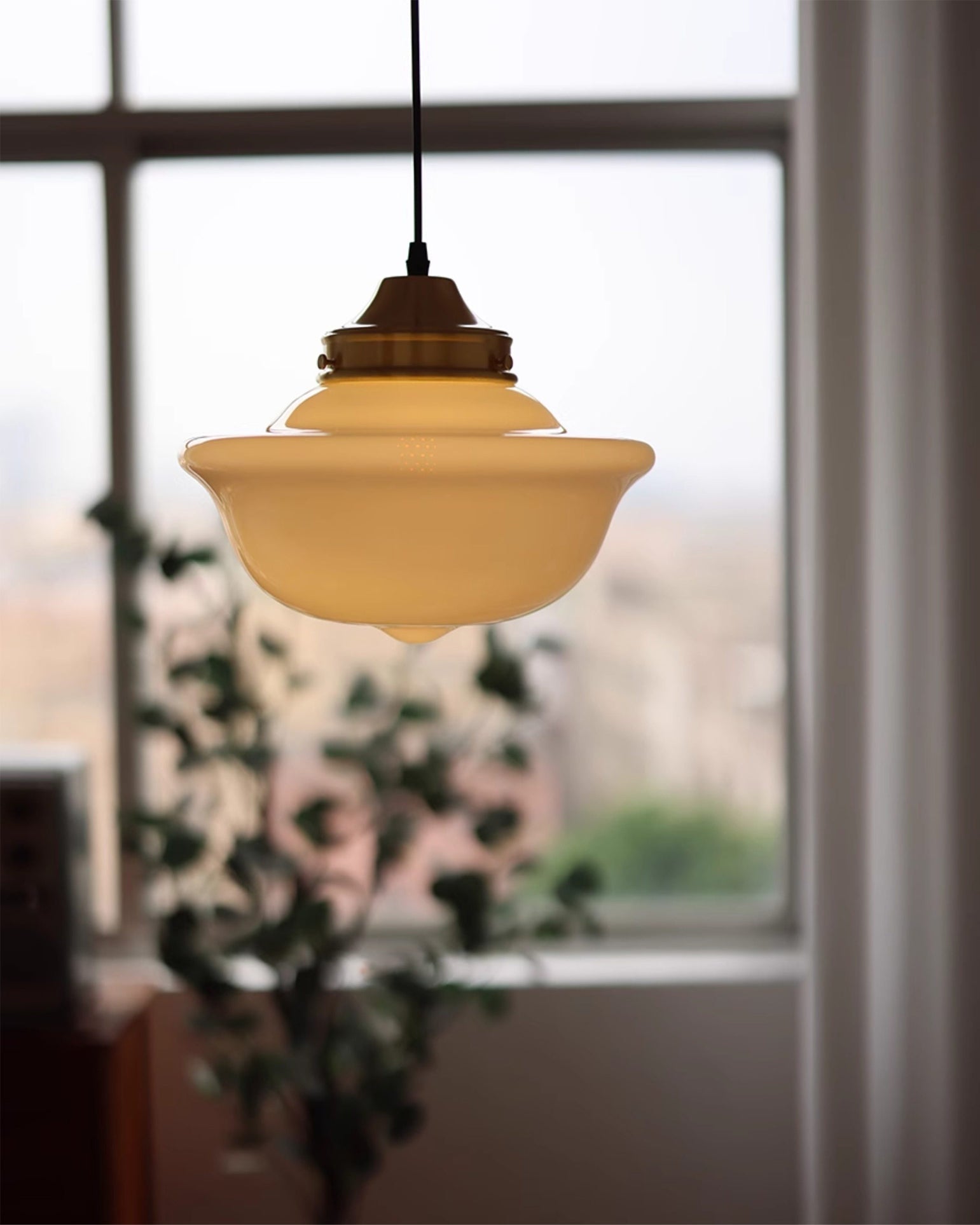 Pathson Pendant Light hanging in a modern interior setting.