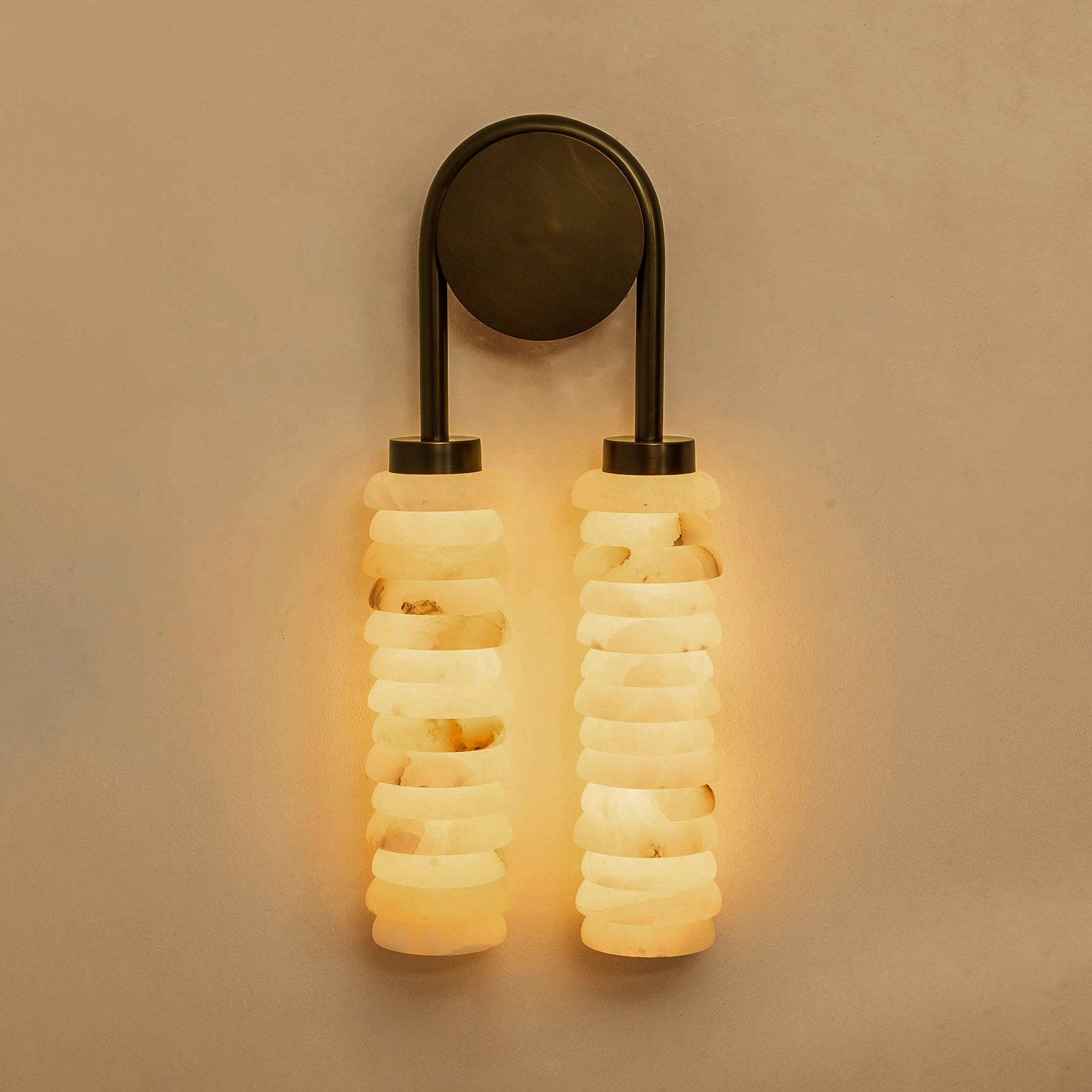 The lamp casting artistic shadows on the wall.