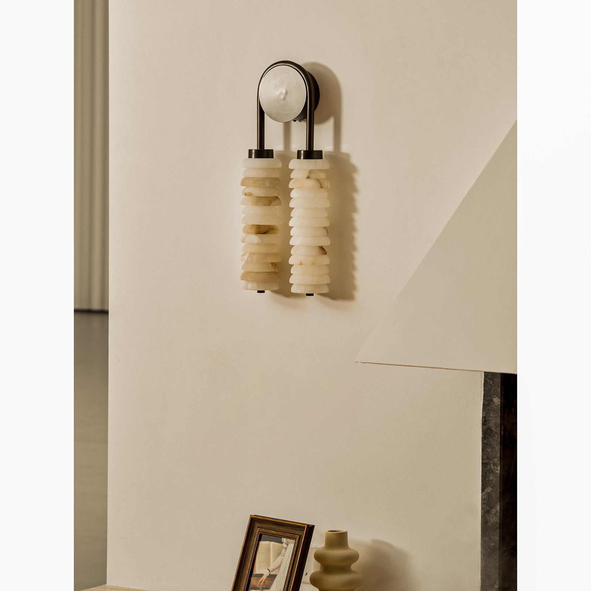 Payson Double Alabaster Wall Lamp in a minimalist entryway.