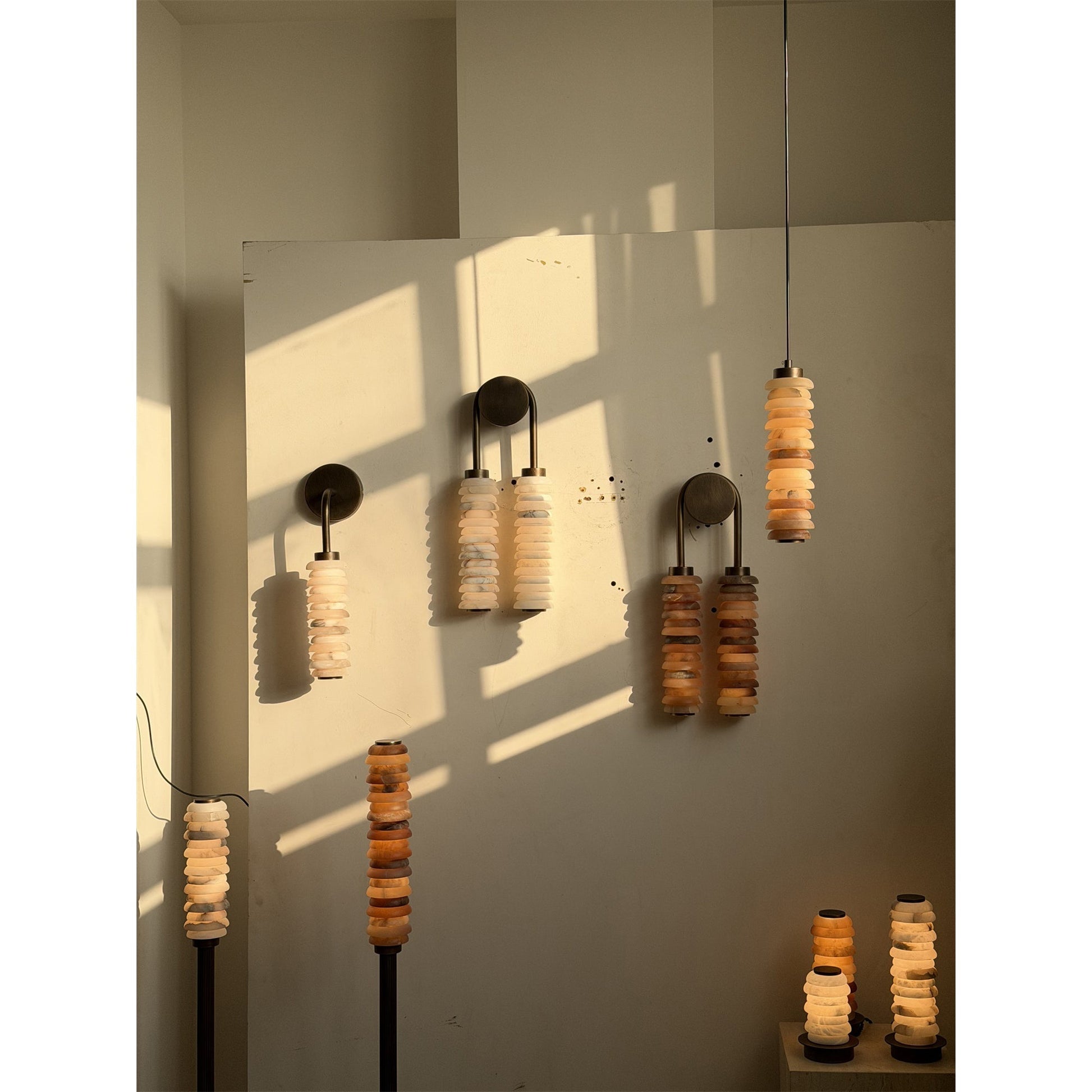The lamp's warm light reflecting on a nearby wall.