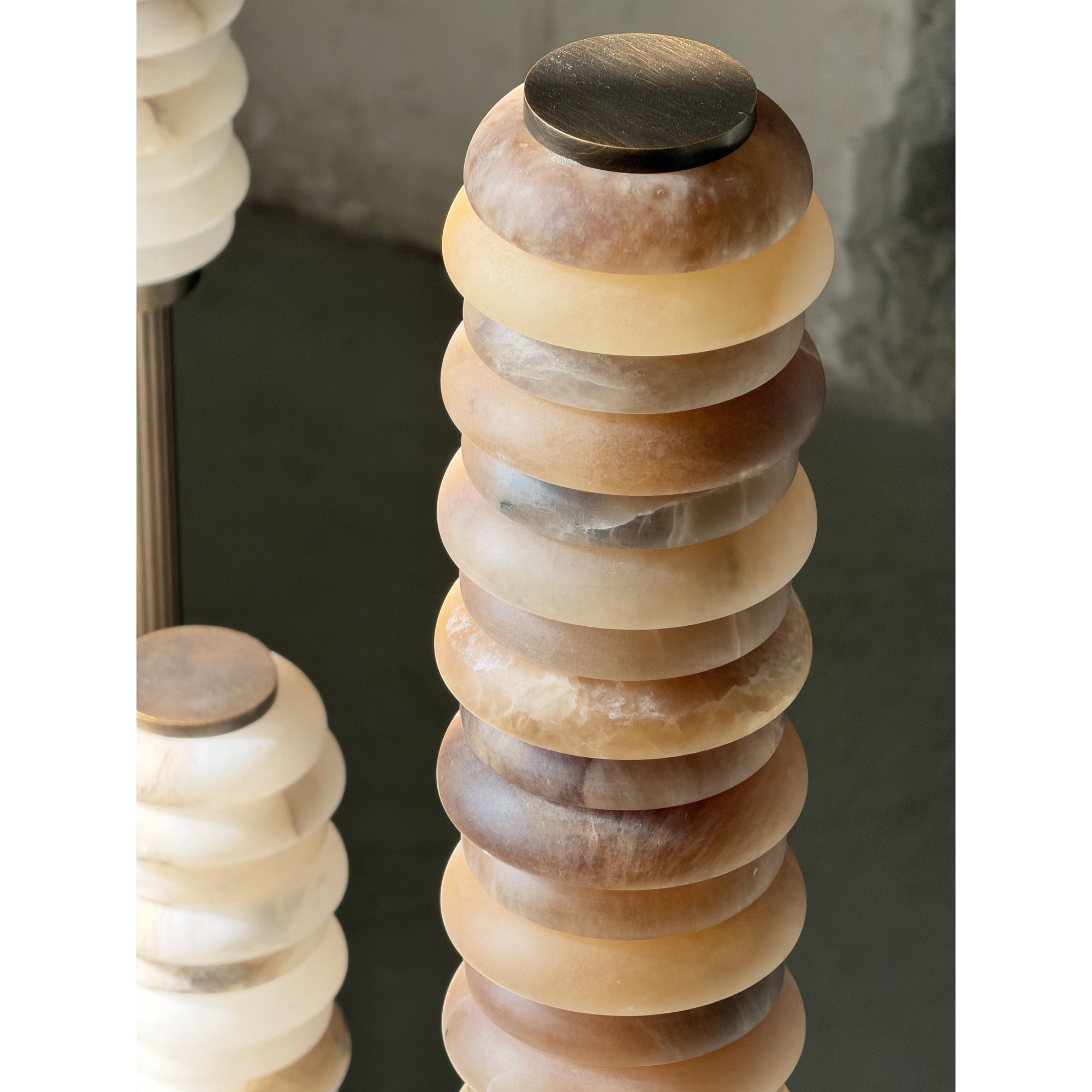 The integrated LED light source within the alabaster shade.