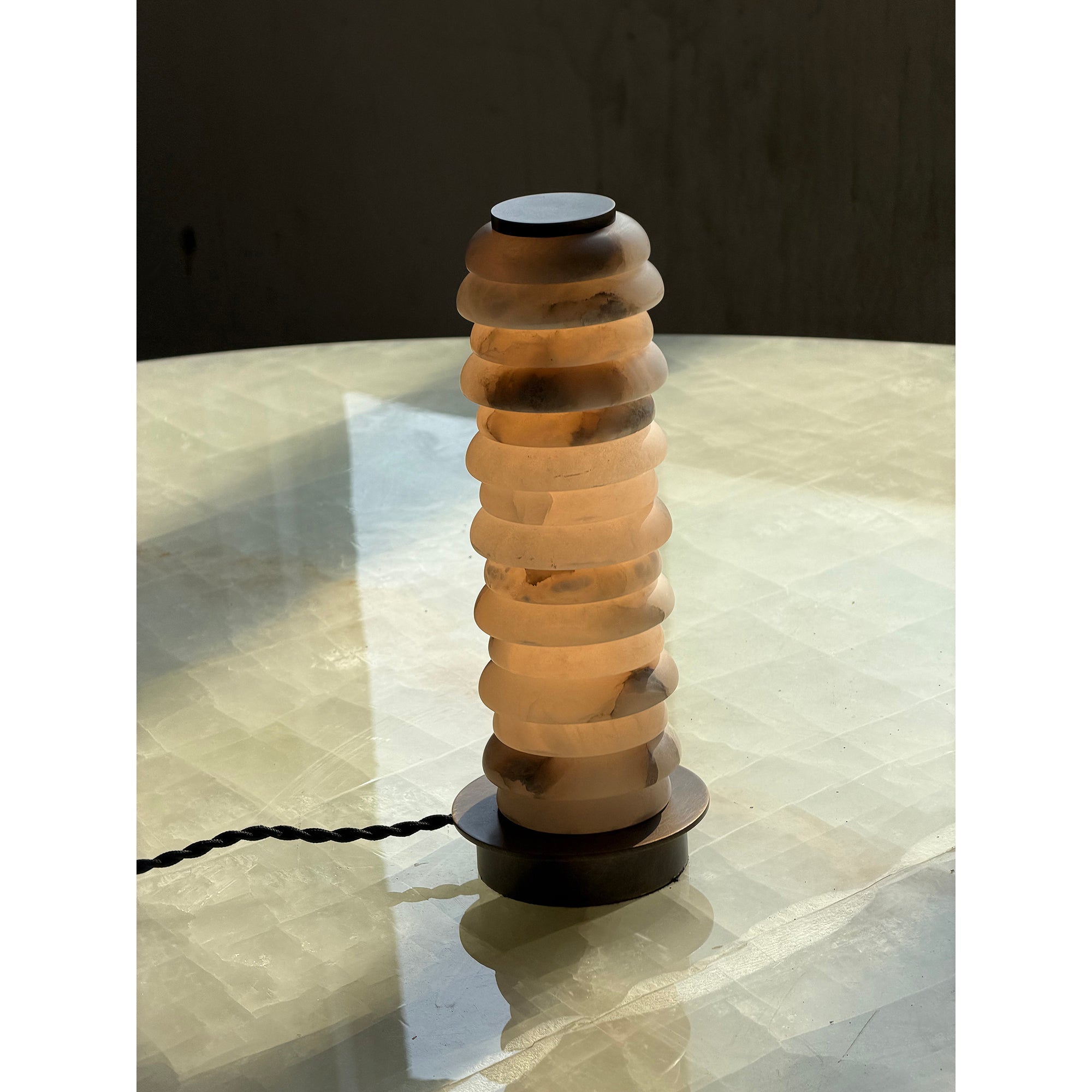 Close-up of the Payson Alabaster Table Lamp with an antique brass finish.