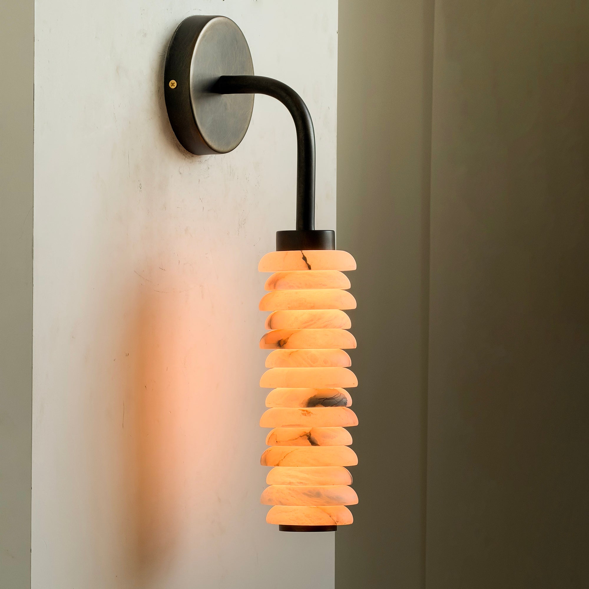 Payson Alabaster Wall Sconce in white, unlit.