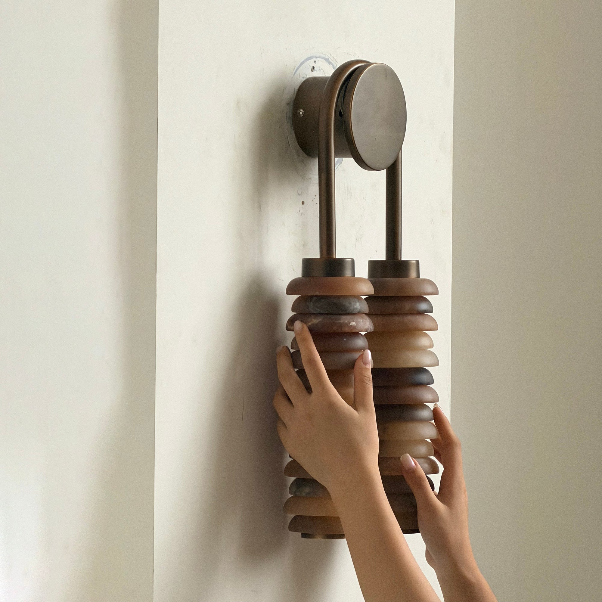 Front view of the Payson Alabaster Wall Lamp showcasing its cylindrical shade.
