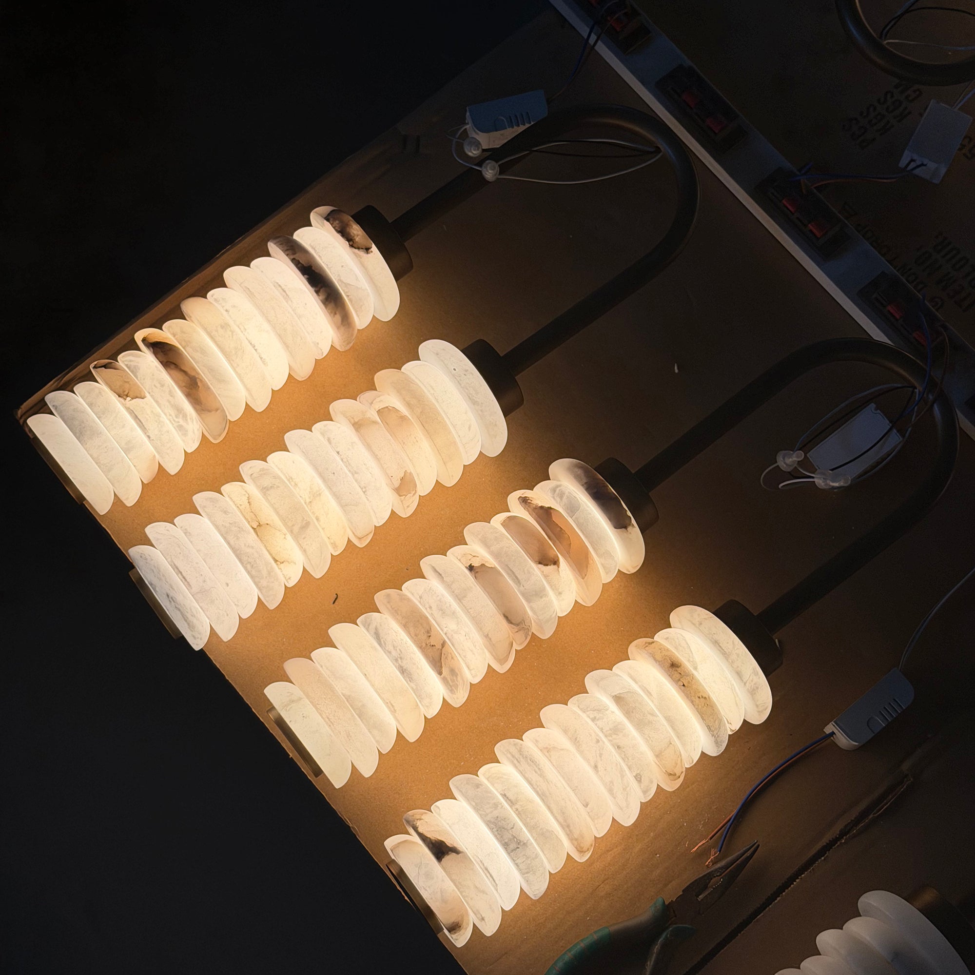 Angled view highlighting the texture of the alabaster and brass.