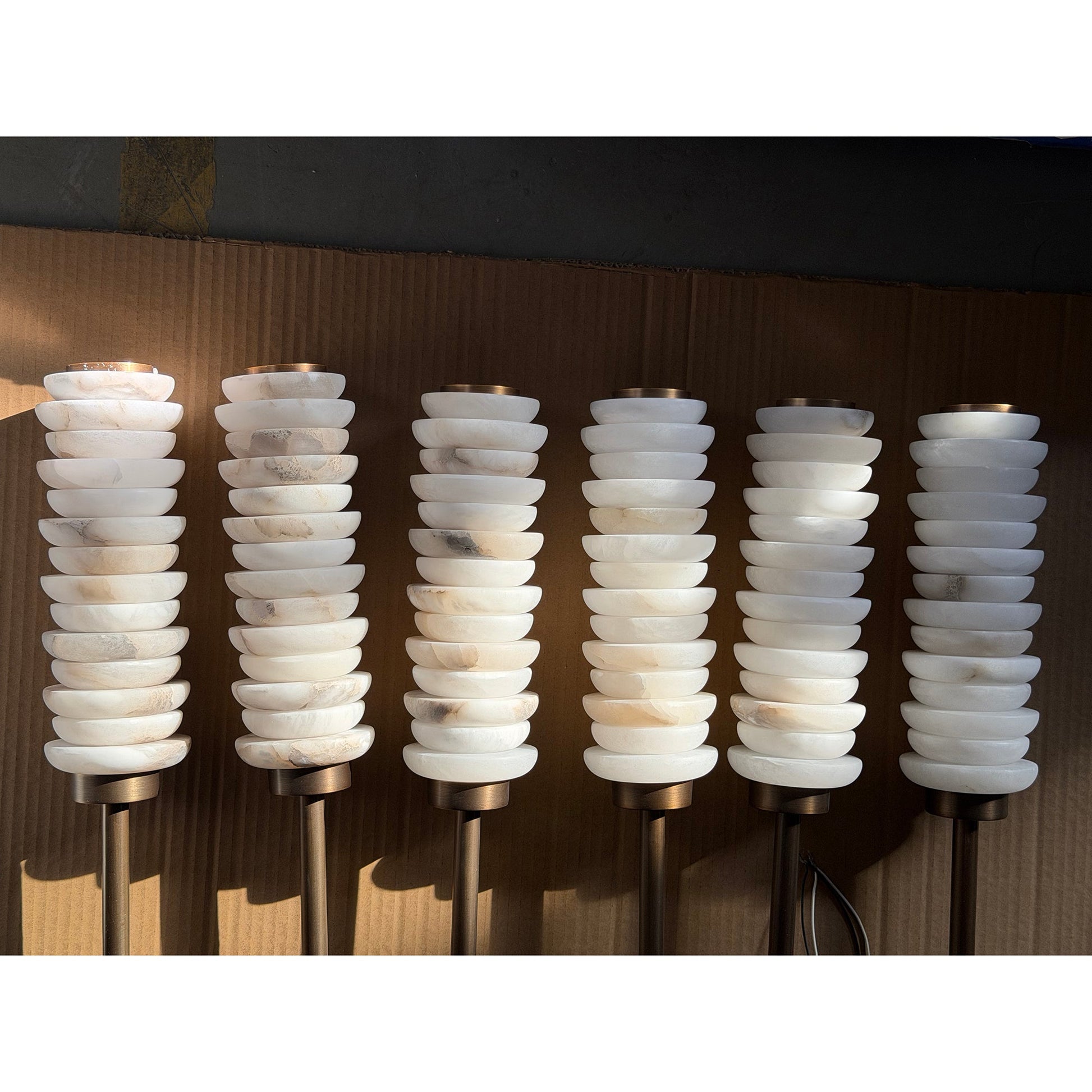Payson Alabaster Wall Lamp in a modern living room setting.