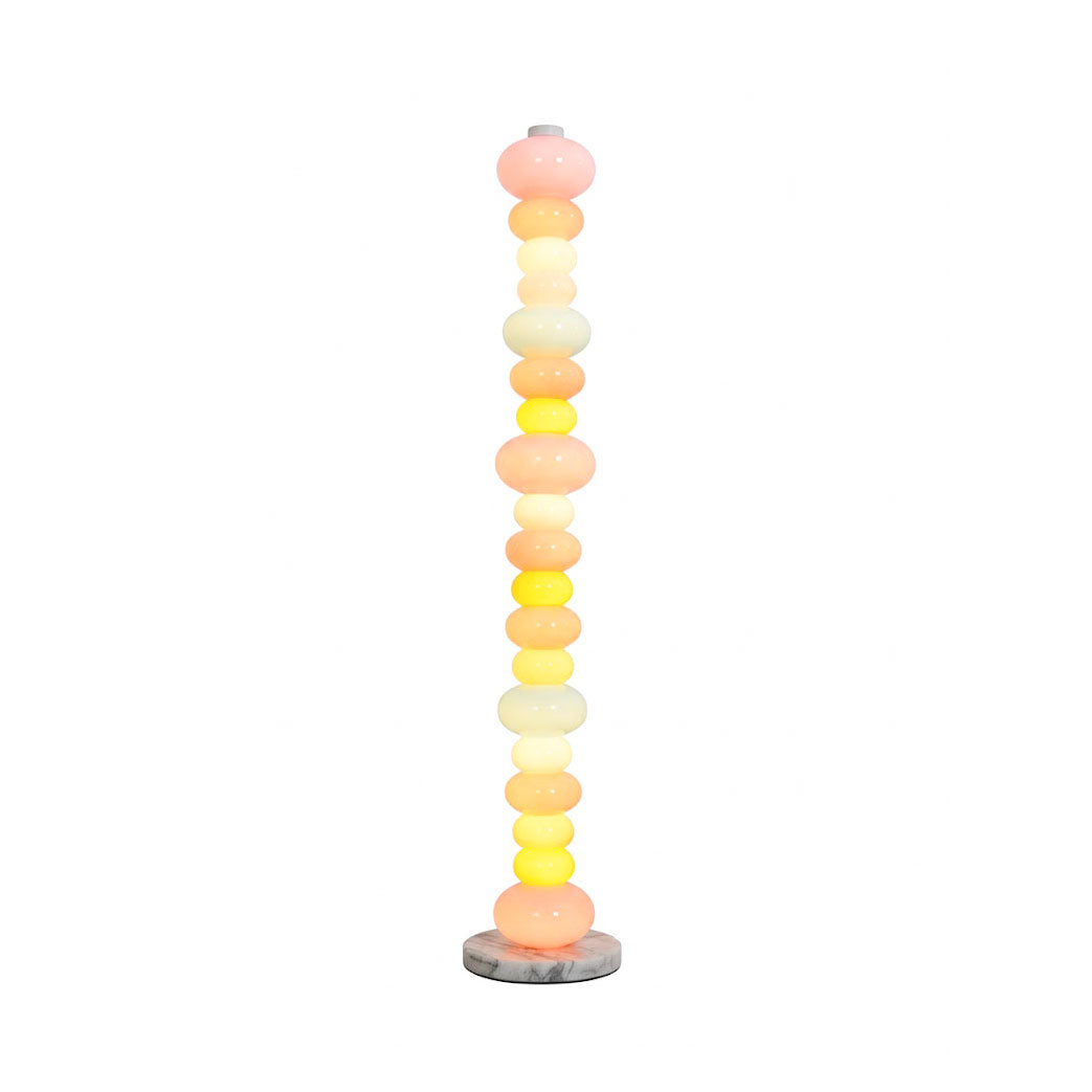 Pebbles Candy Floor Lamp in a modern living room setting.