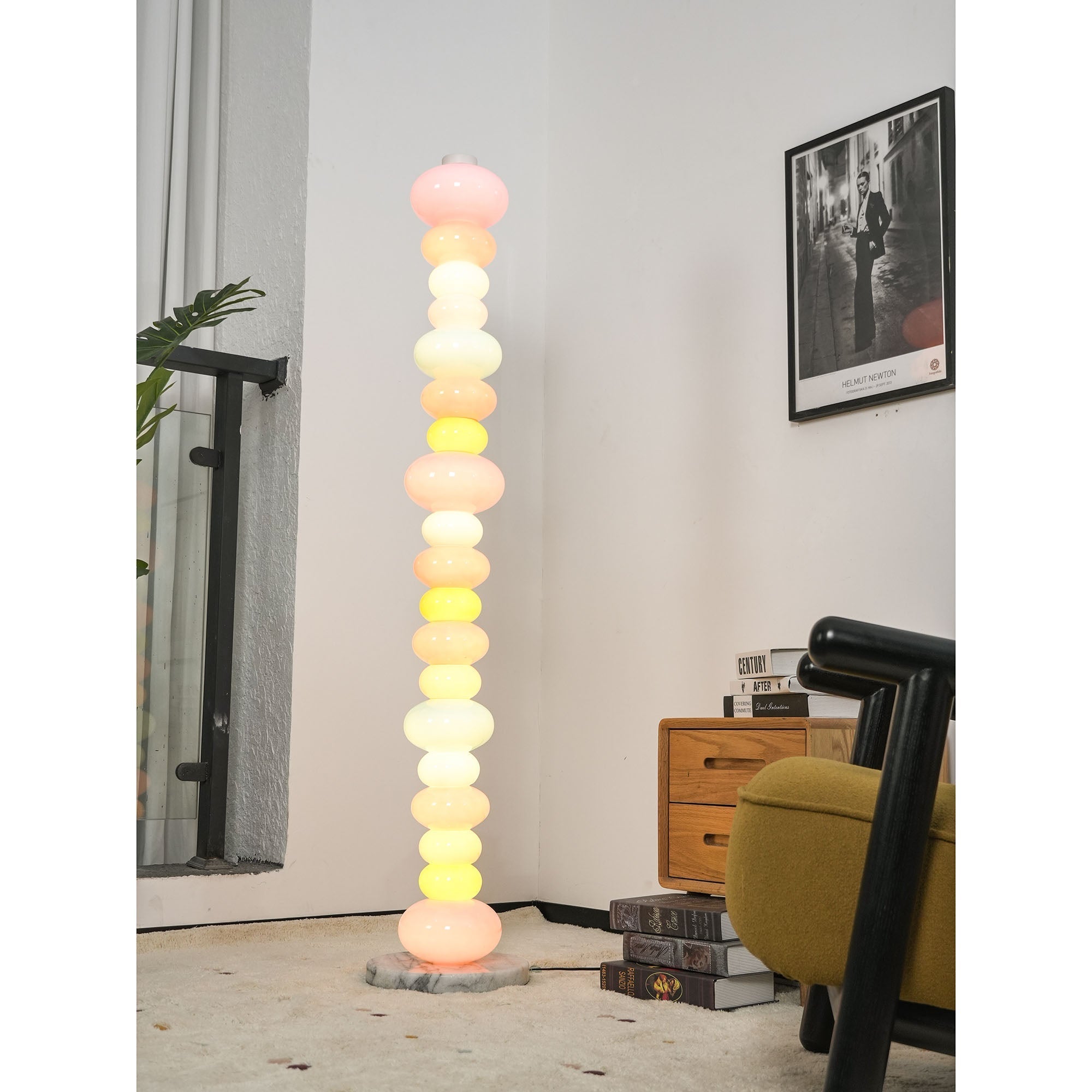 Lifestyle image featuring the floor lamp next to a contemporary sofa.