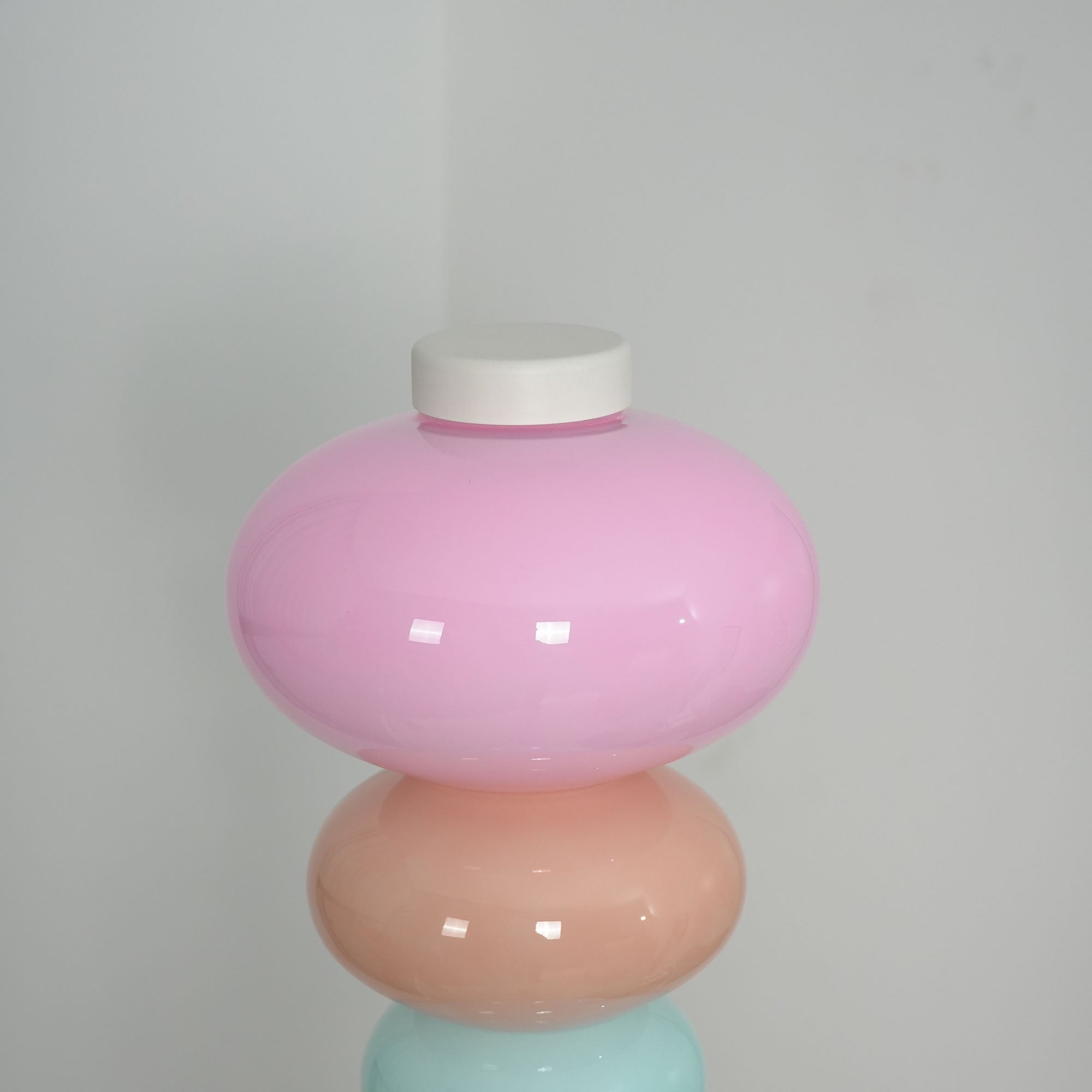 The floor lamp as the primary light source in a dark room.