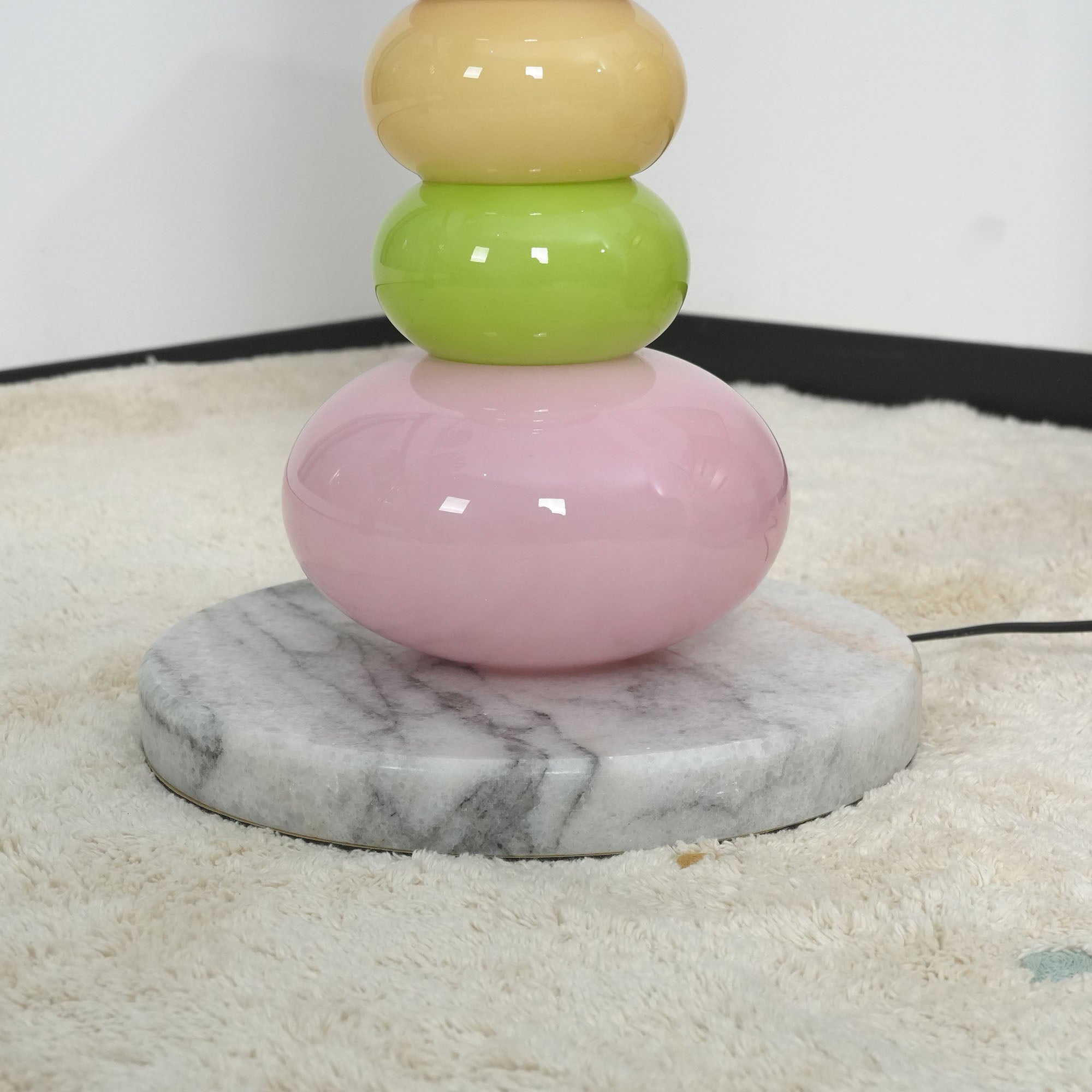 A group of Pebbles Candy Floor Lamps in various colors.