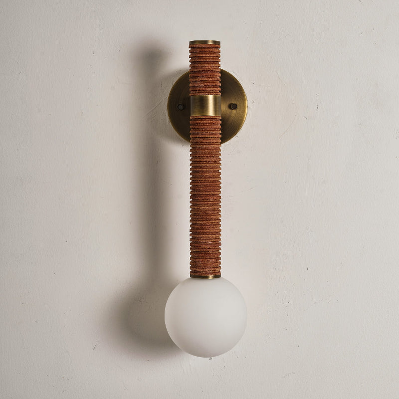 The Threadline sconce with a black leather finish for a contemporary look.