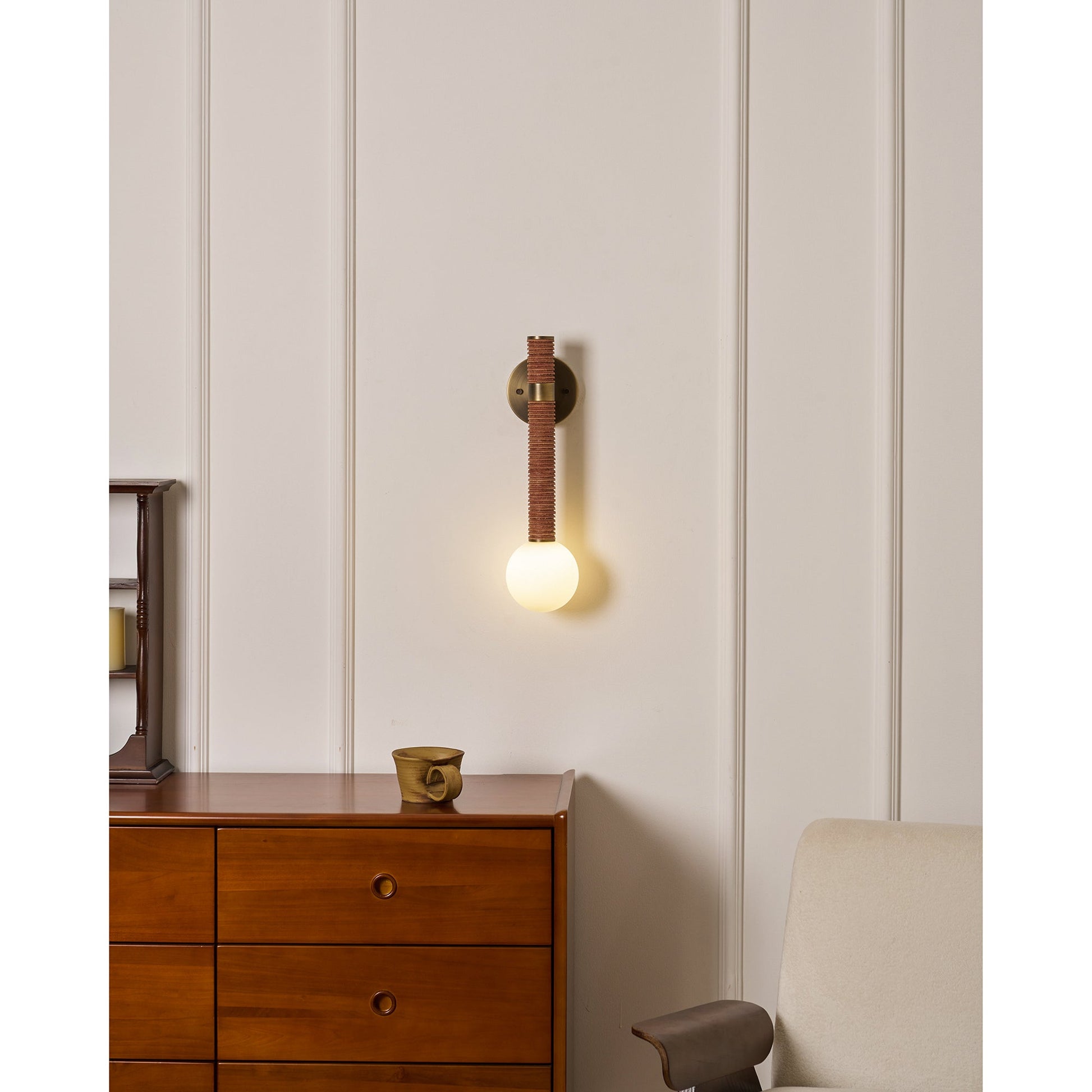 The Threadline sconce shown unlit to display its material textures.