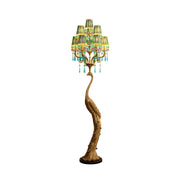 Perky Peacock Floor Lamp with brass body and six fabric shades.