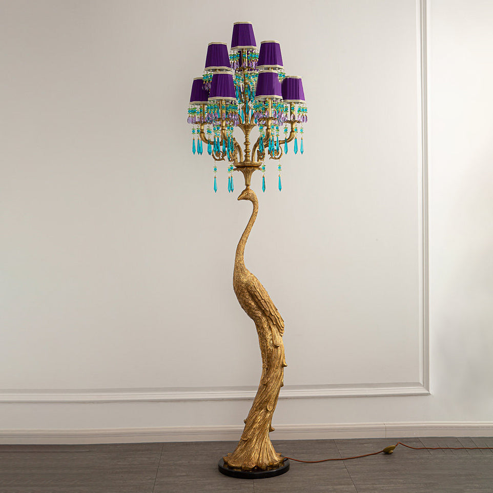 The arched neck silhouette of the brass peacock.