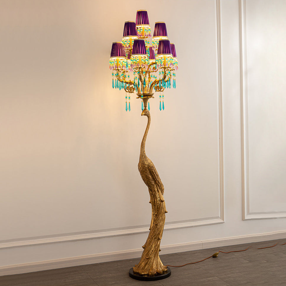 Lifestyle image of the peacock lamp in a hotel suite.