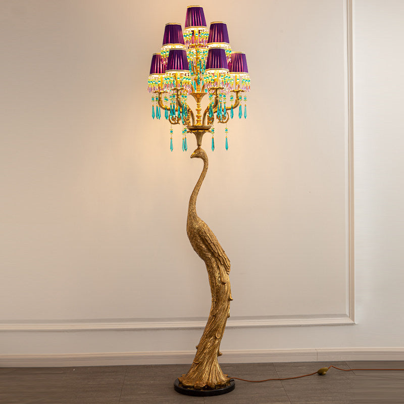 Perky Peacock Floor Lamp against a dark, dramatic background.