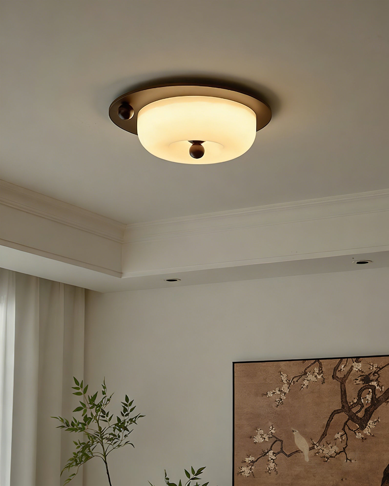 Perth Ceiling Light turned on, showing the warm glow through the cream glass.
