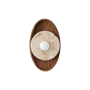 Petra Travertine Wall Sconce with beige stone and walnut backplate.