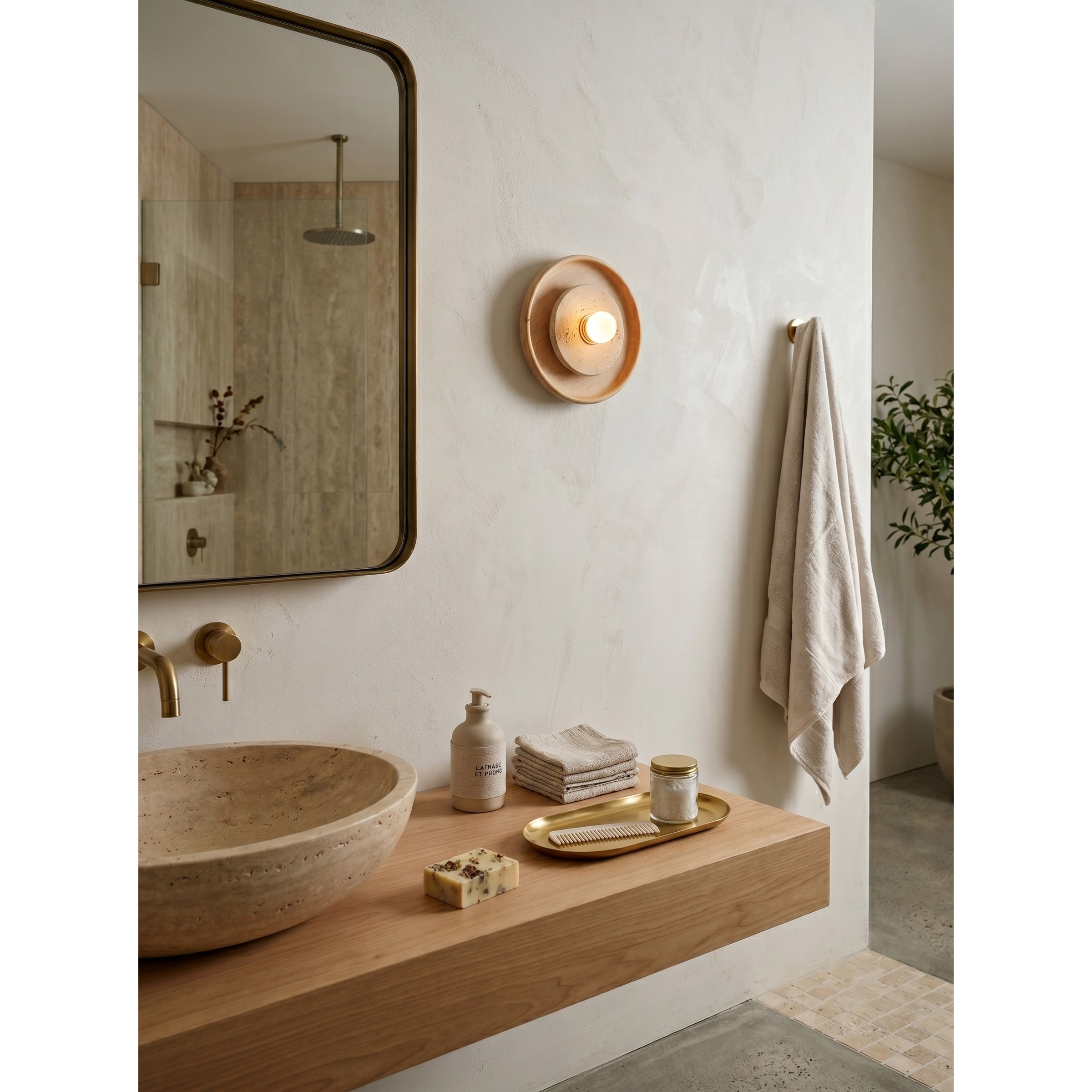 A pair of Petra Wall Sconces flanking a bathroom mirror.
