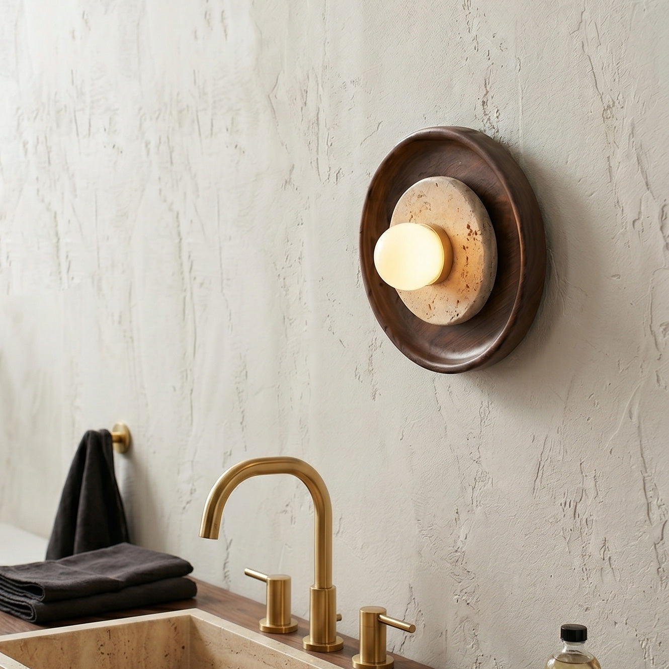 Close-up of the frosted glass globe and travertine texture.