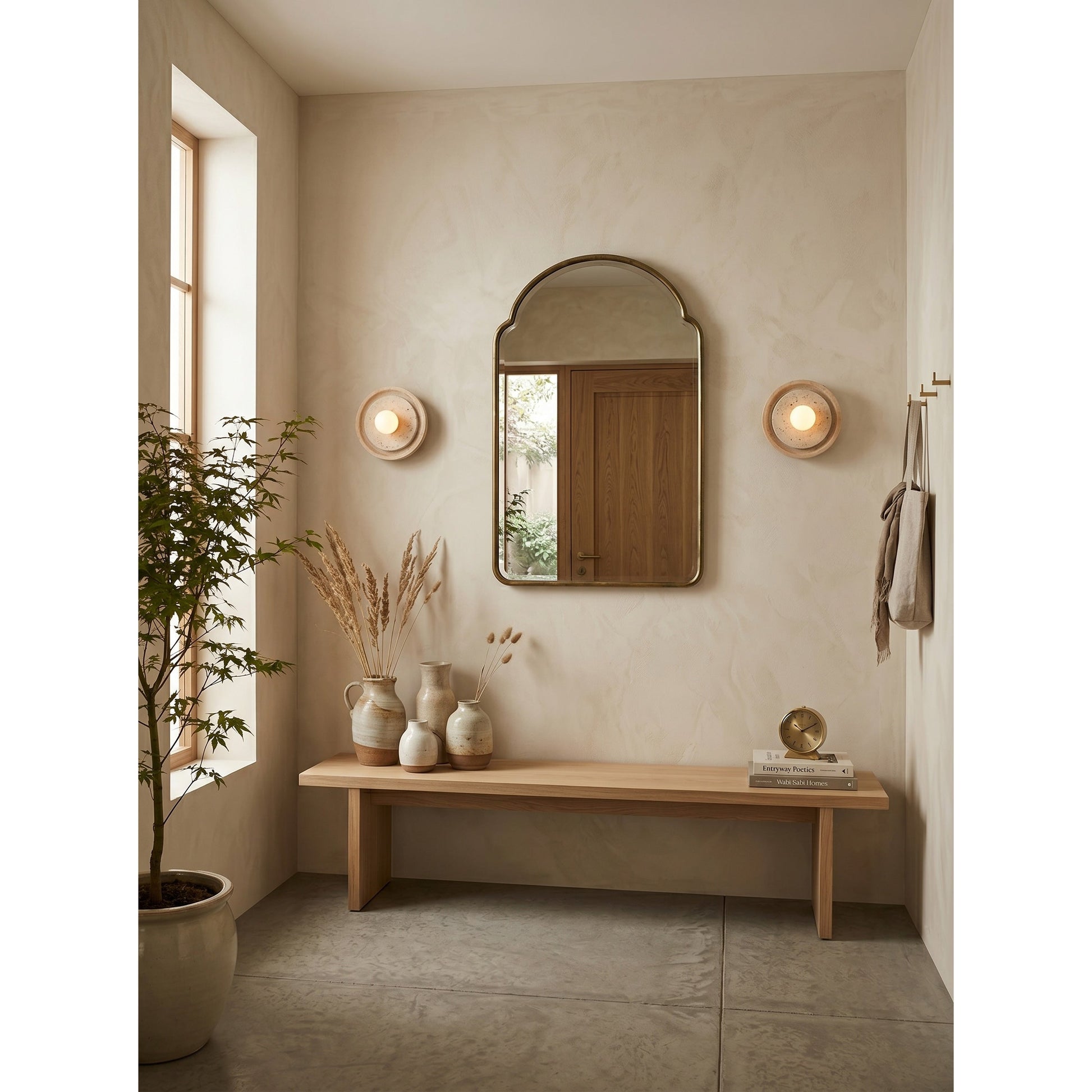 Petra Wall Sconce used as a bedside reading light.