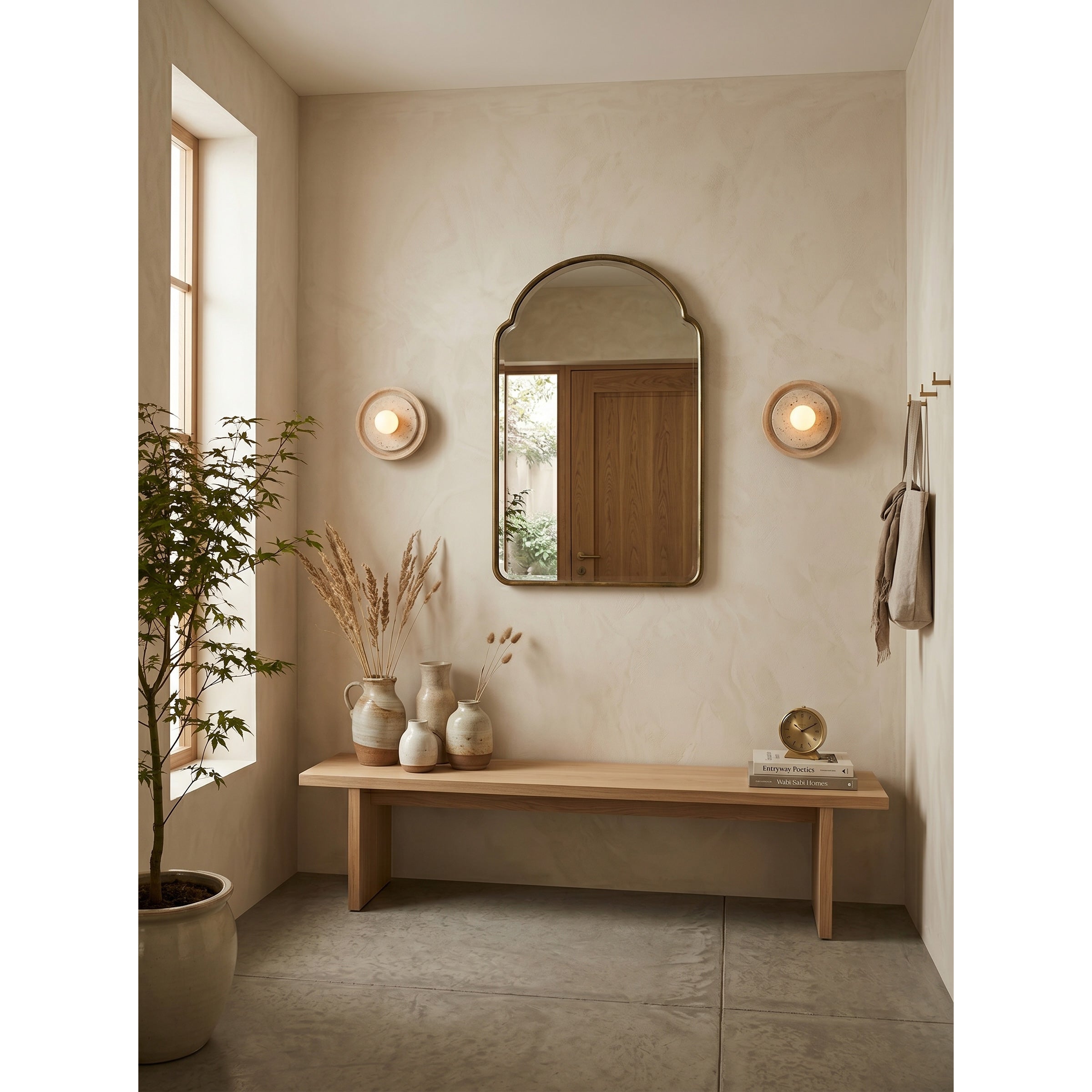 Petra Wall Sconce used as a bedside reading light.
