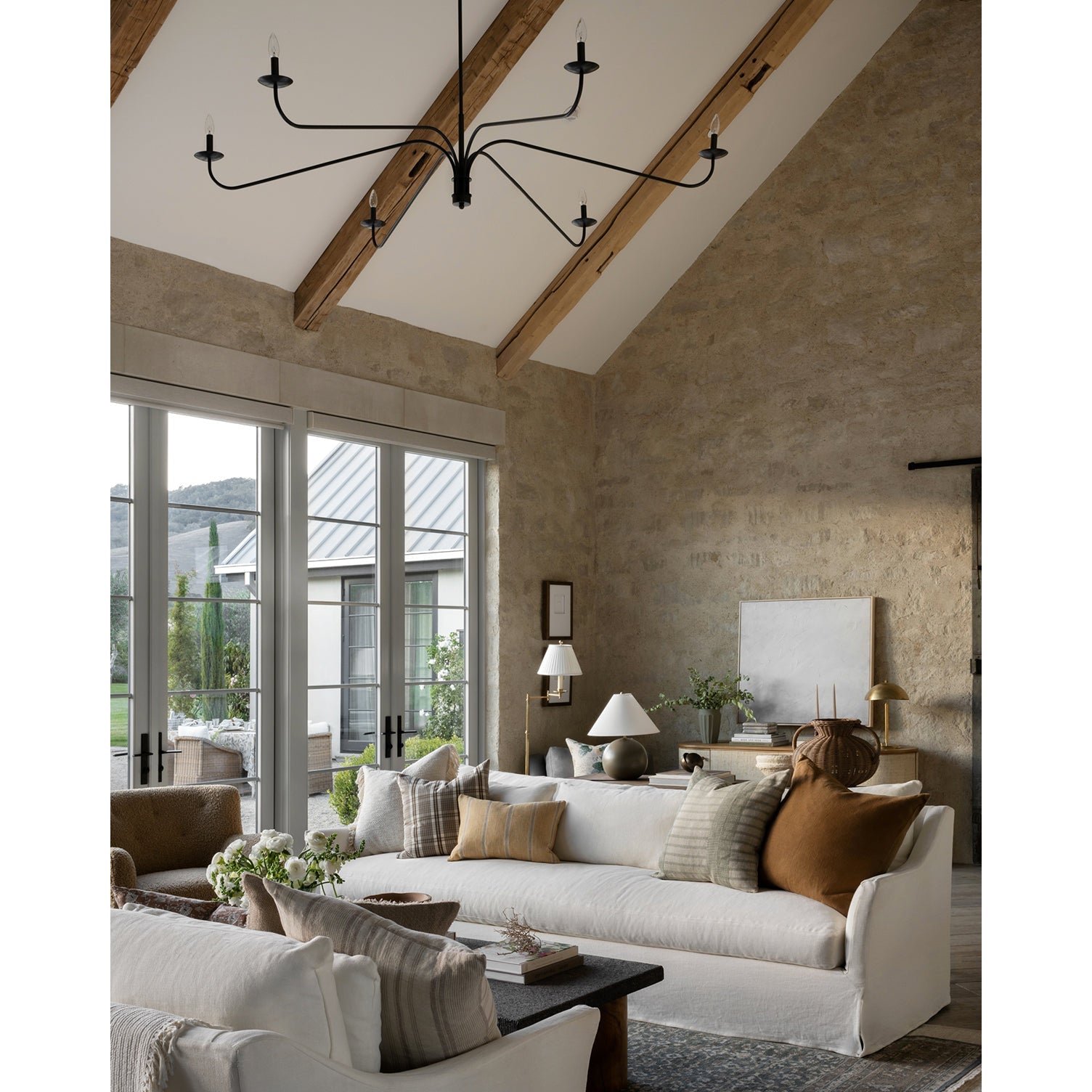 Side profile of the Philomena Chandelier's sweeping arms.