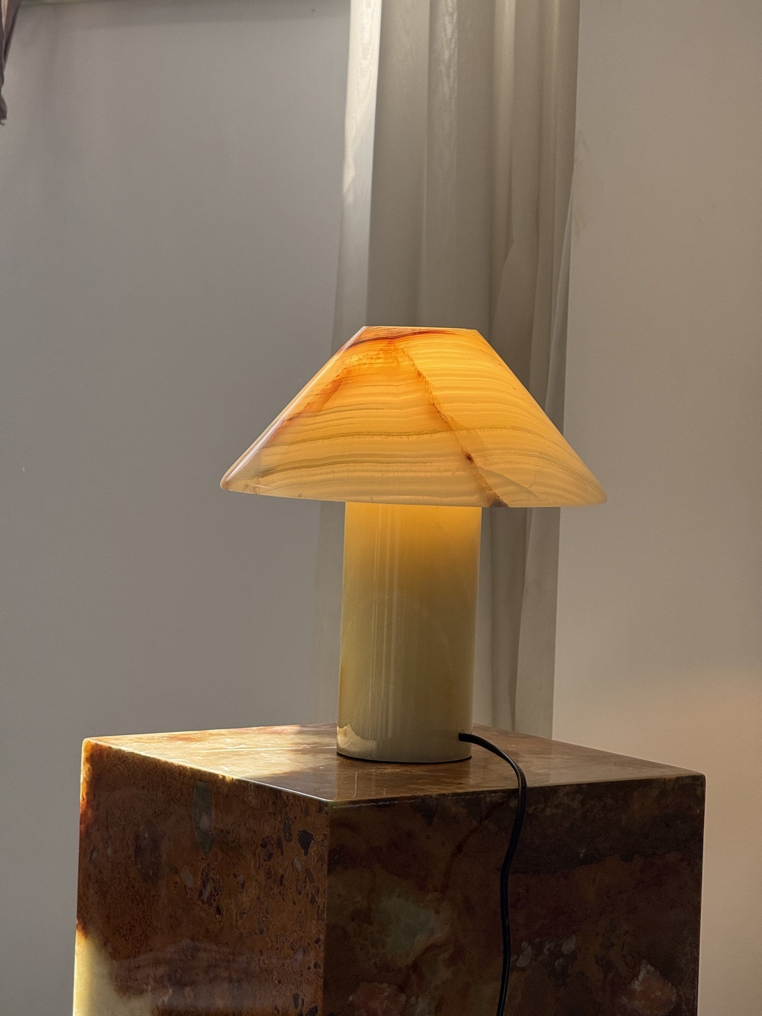 The table light illuminating a reading nook.