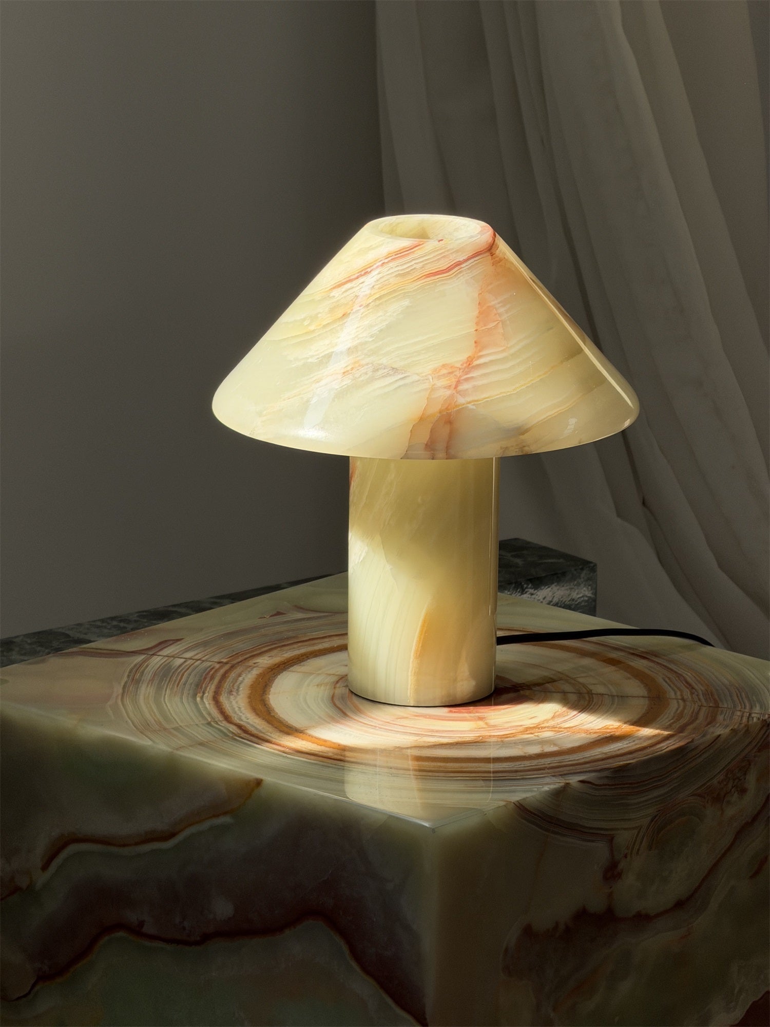 A lifestyle image featuring the Orange Onyx lamp.
