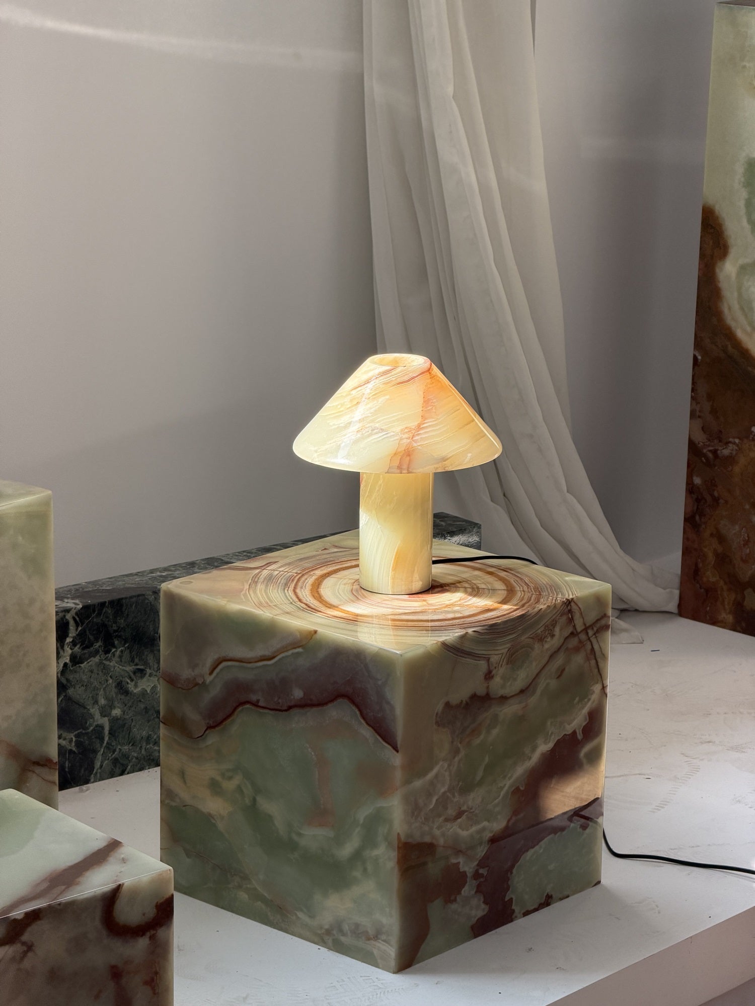 A lifestyle image featuring the Purple Onyx lamp.