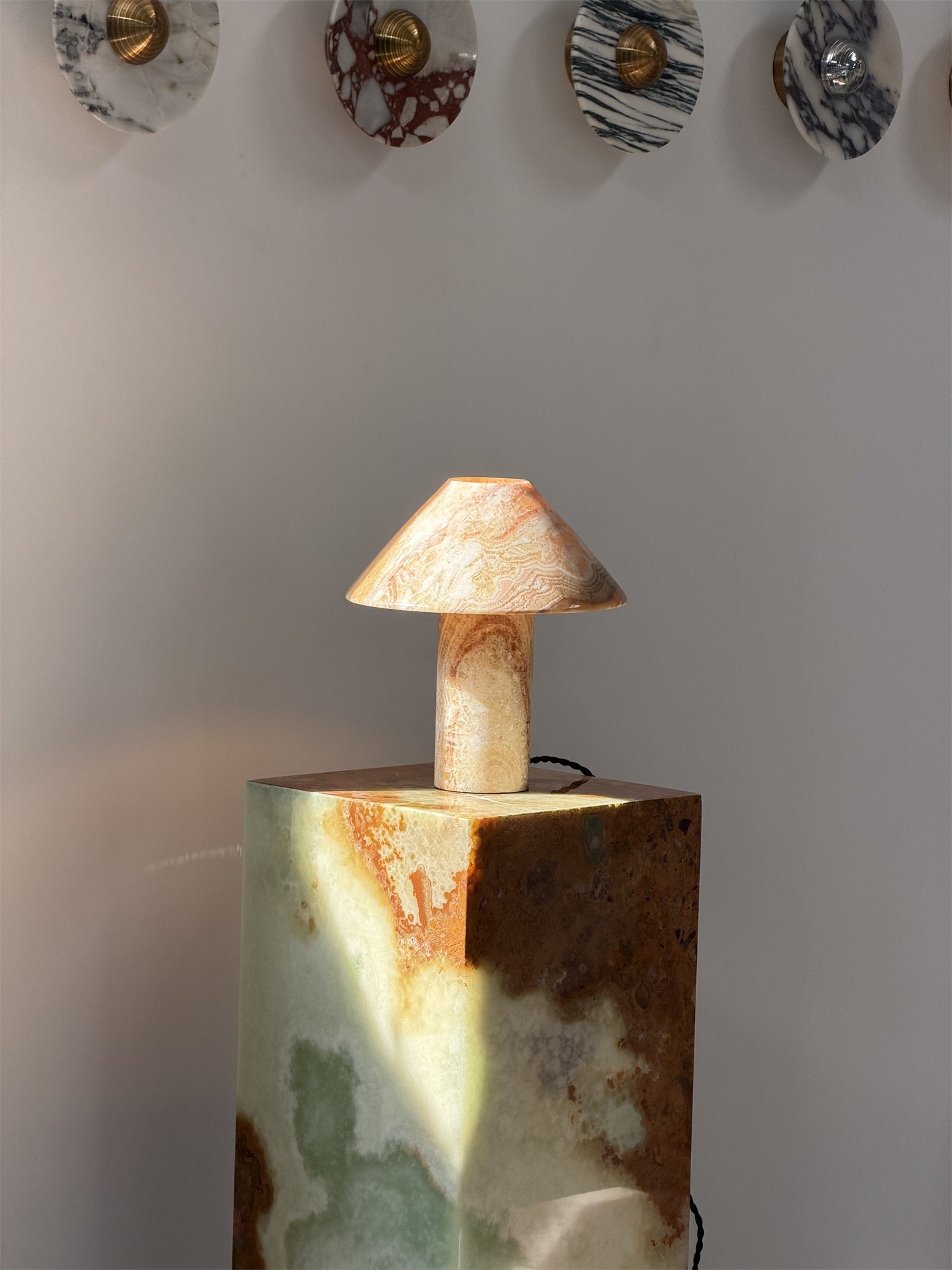 A lifestyle image featuring the Cyan Onyx lamp.