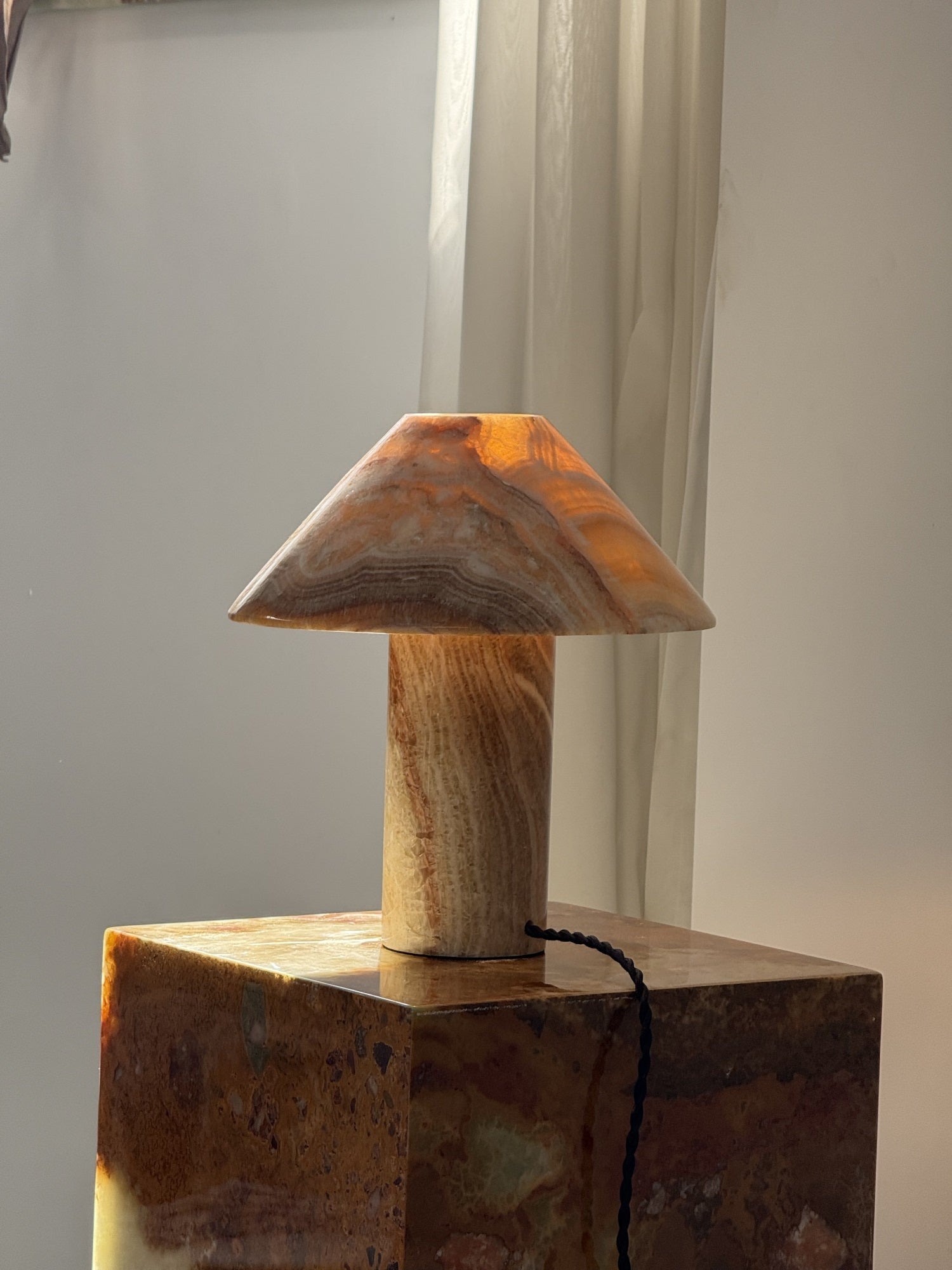 Scale of the lamp next to a book.