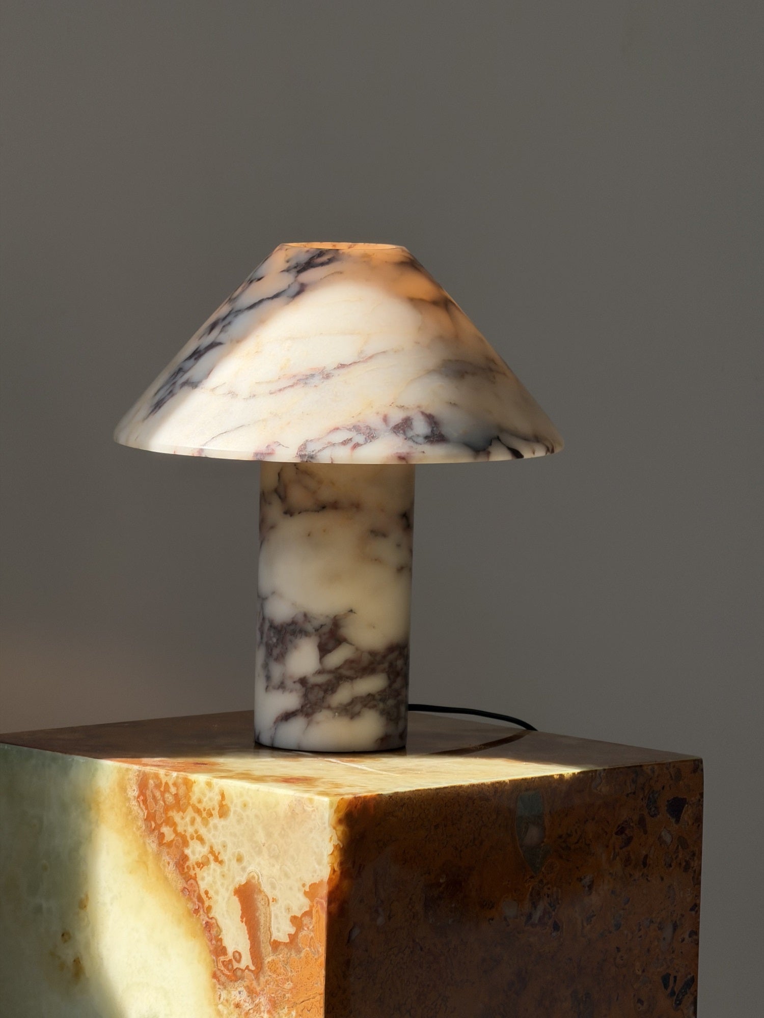 The table light shown on a bedside table.