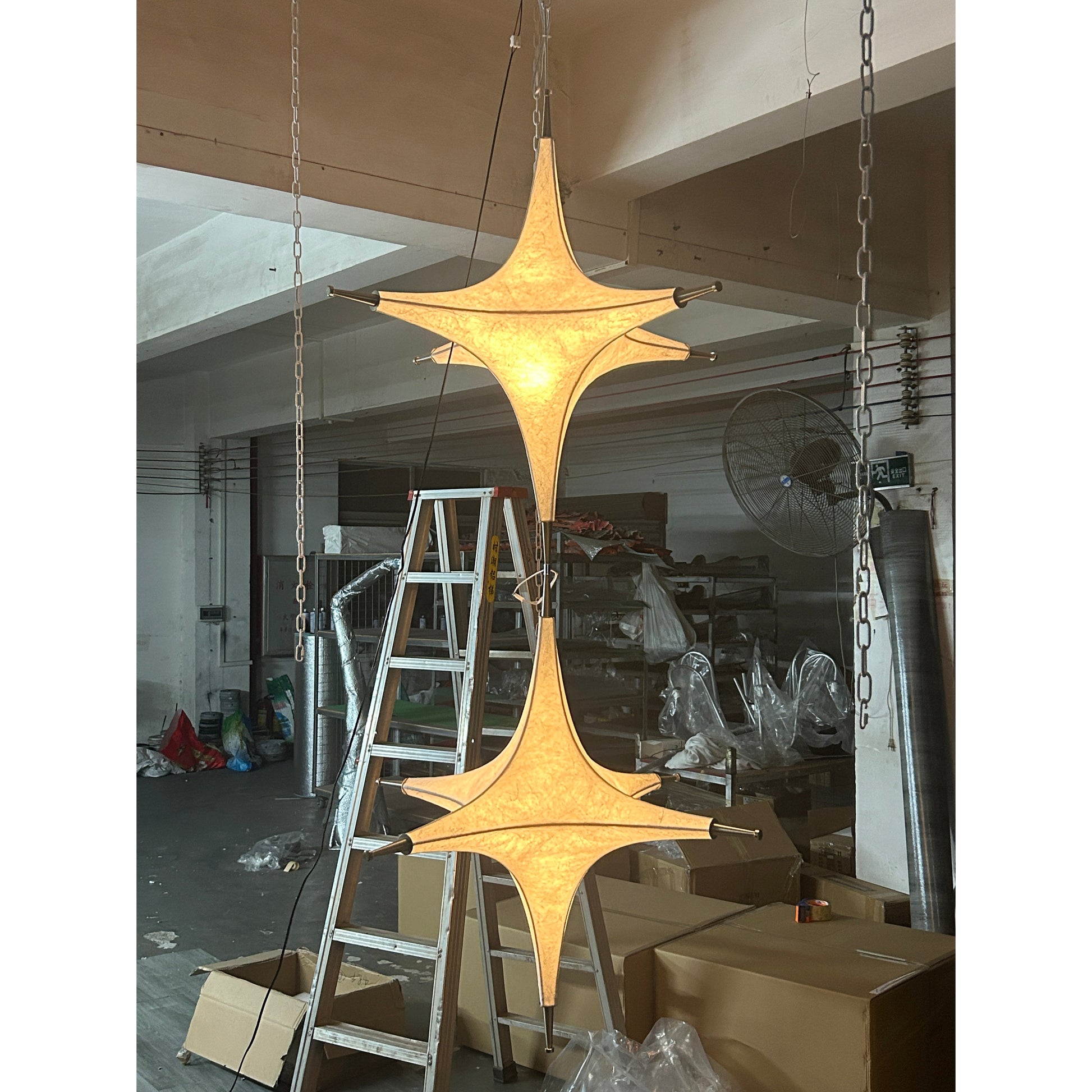 Side profile of the white Polar Chandelier, highlighting its elegant, rounded form.