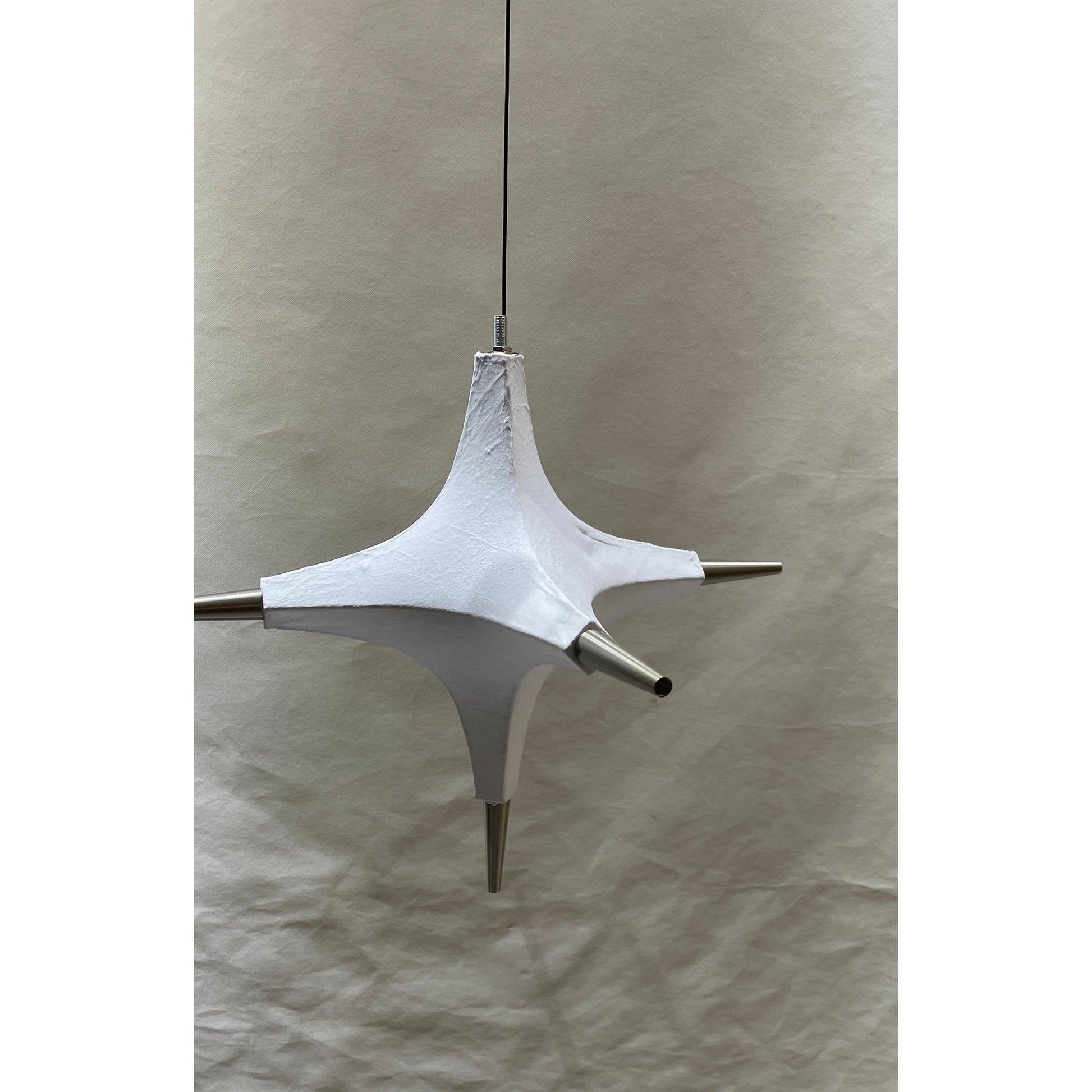 The Polar Chandelier in a spacious, open-plan living area.