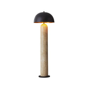 Portia Floor Lamp with a beige travertine base and black metal shade.