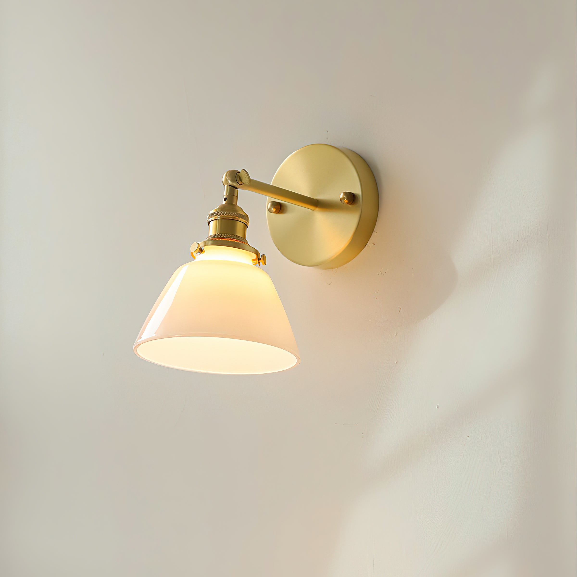 Angled view of the industrial-style Portland Swivel Wall Sconce.