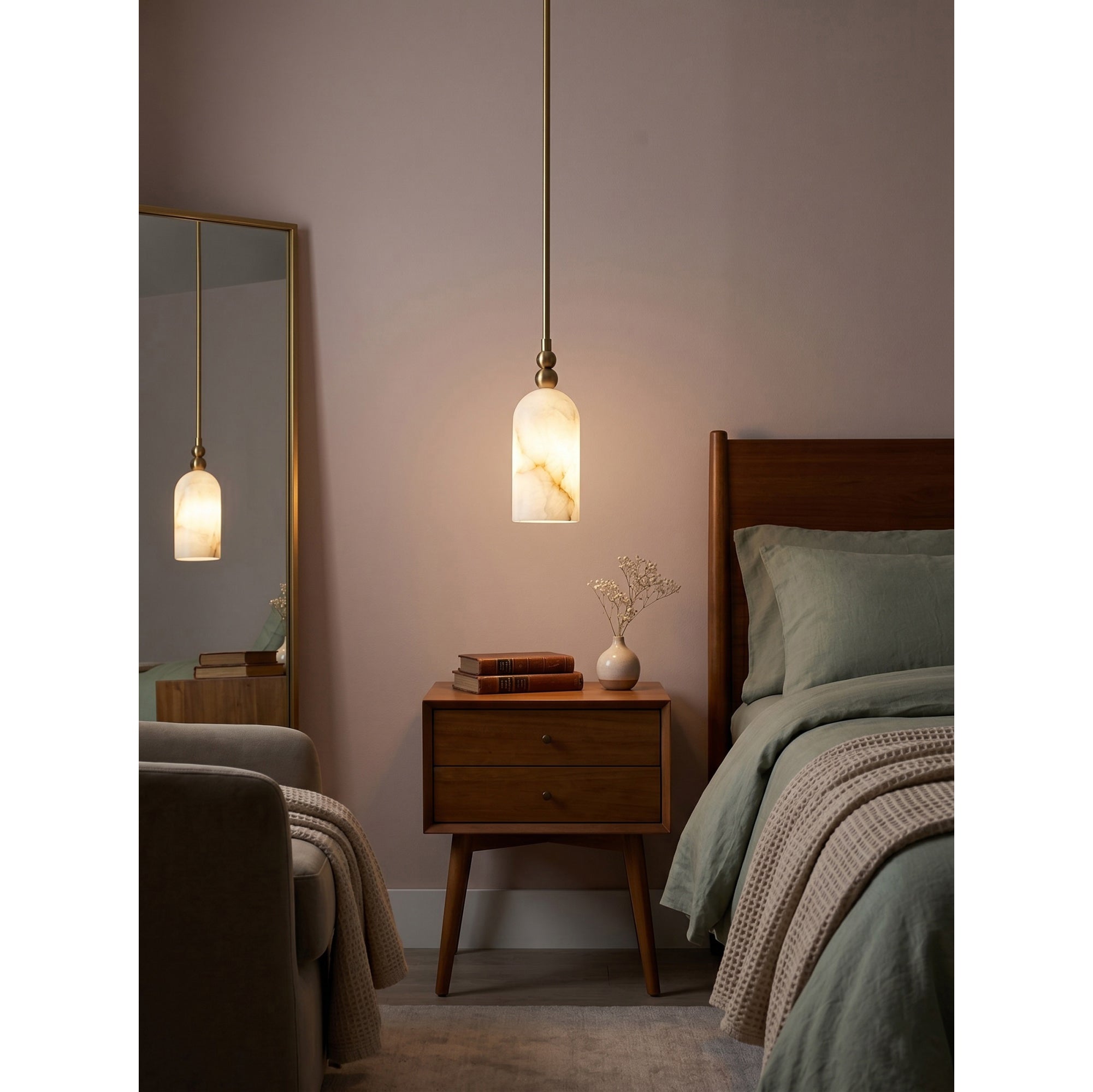 The Pratt Alabaster Pendant Lamp in a bedroom setting over a nightstand.