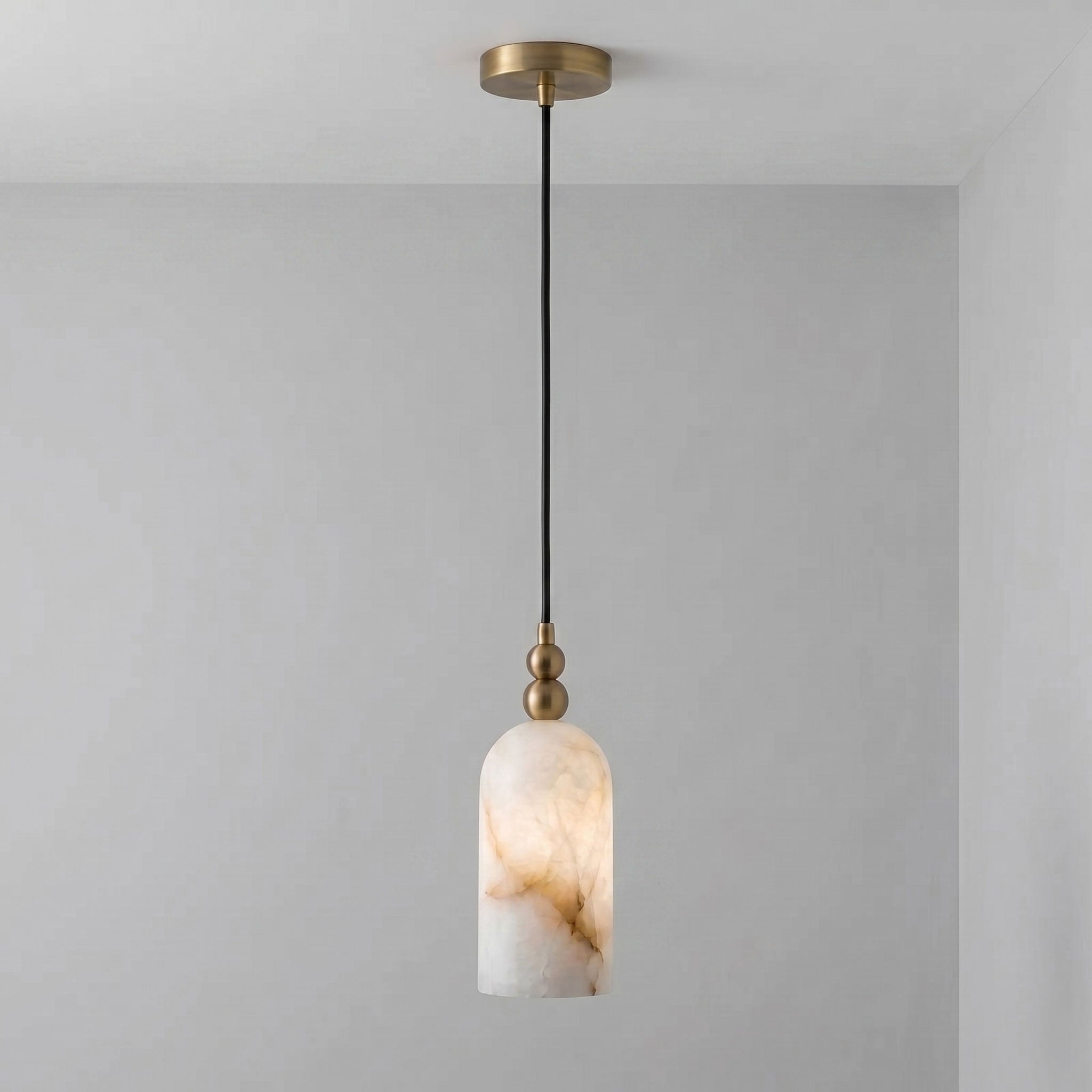 The lamp against a dark wall to emphasize its glowing effect.