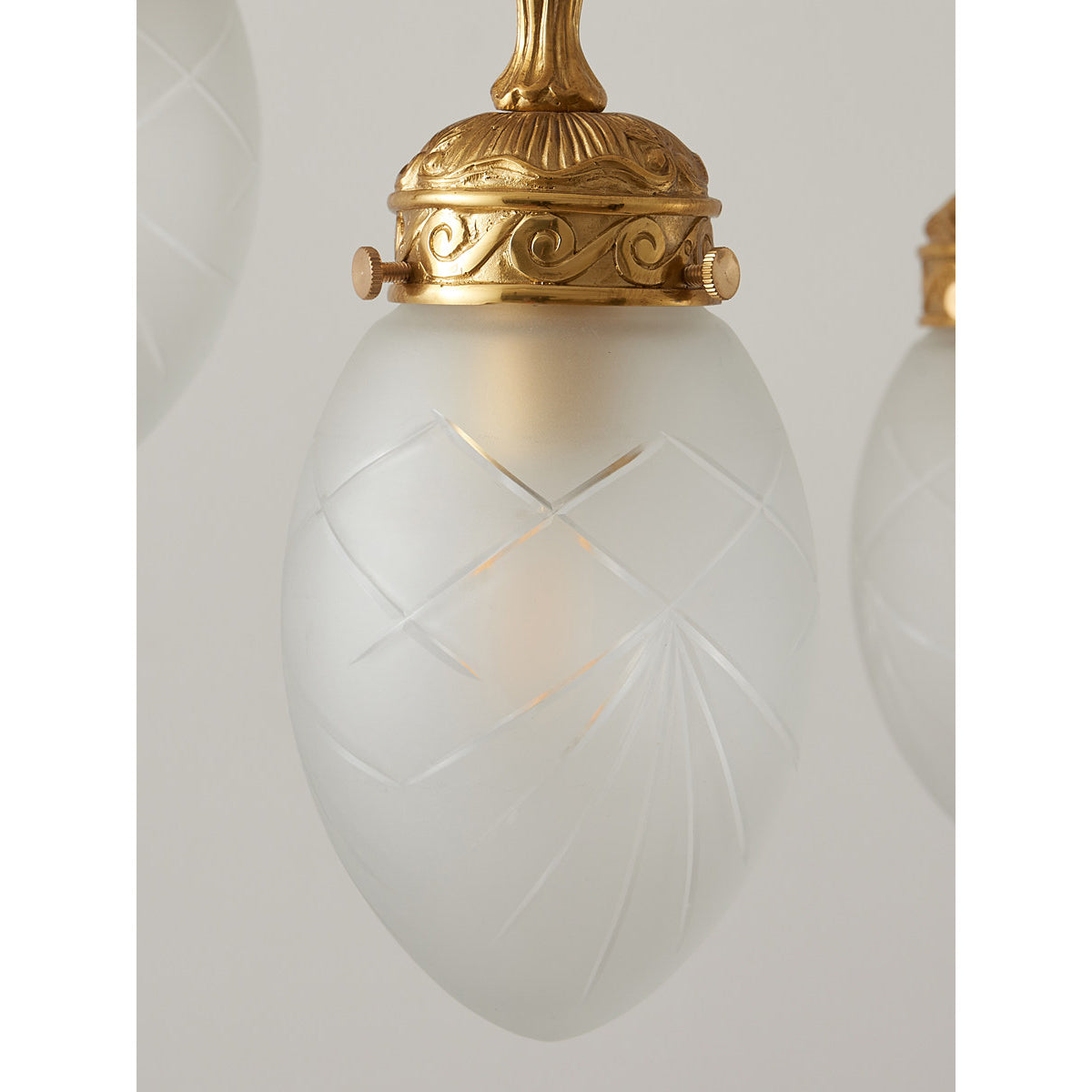 The Quezal Chandelier adding a touch of sophistication to a room.