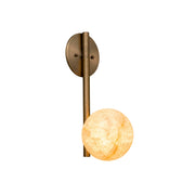 Adrion Alabaster Wall Sconce against a neutral wall.
