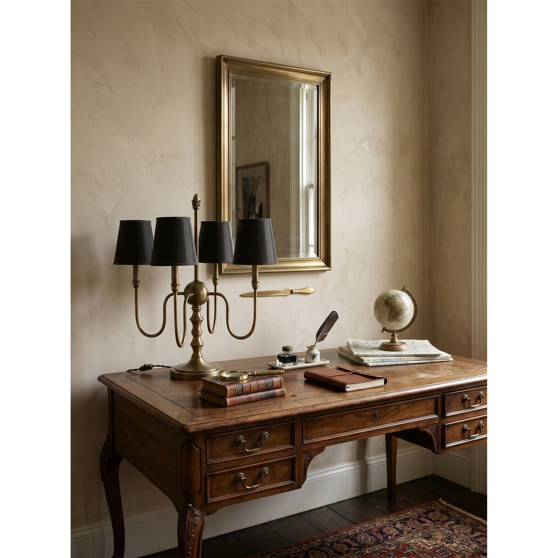 Lifestyle image of the lamp on an entryway table against a dark wall.