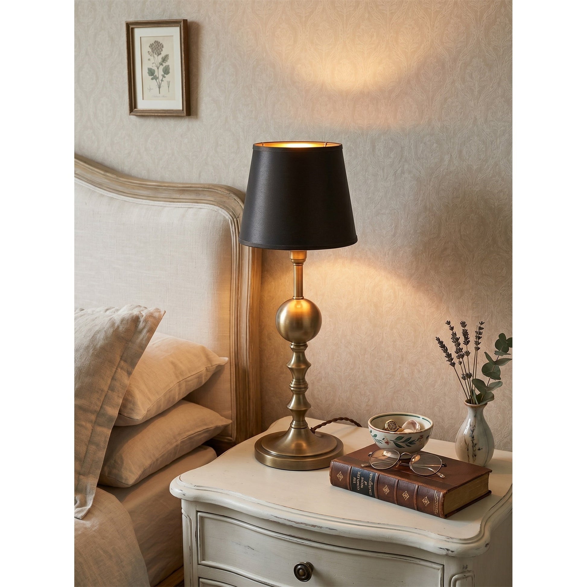 The lamp casting an intimate glow on a wooden desk.