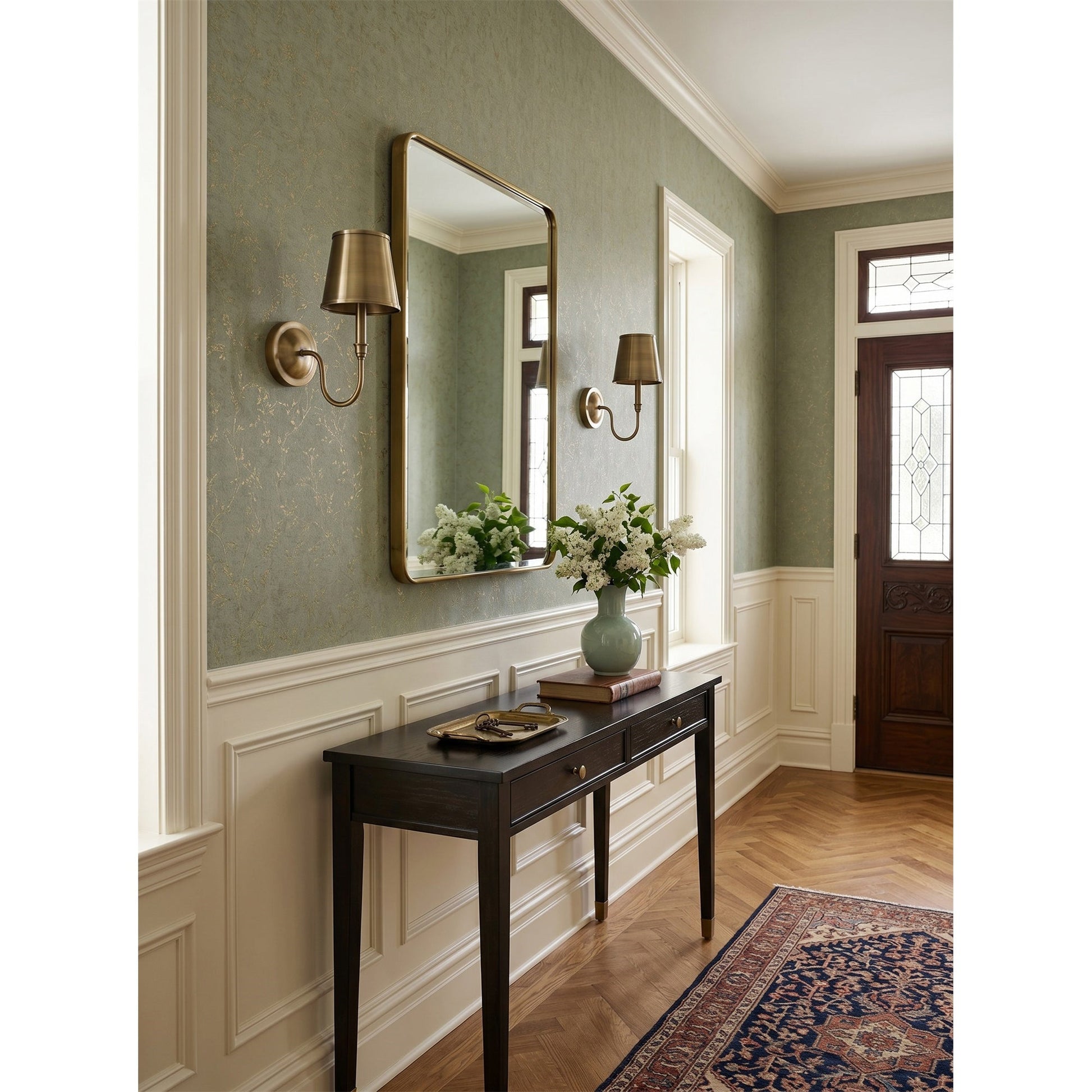 Angled view of the Alden Wall Sconce against a neutral wall.