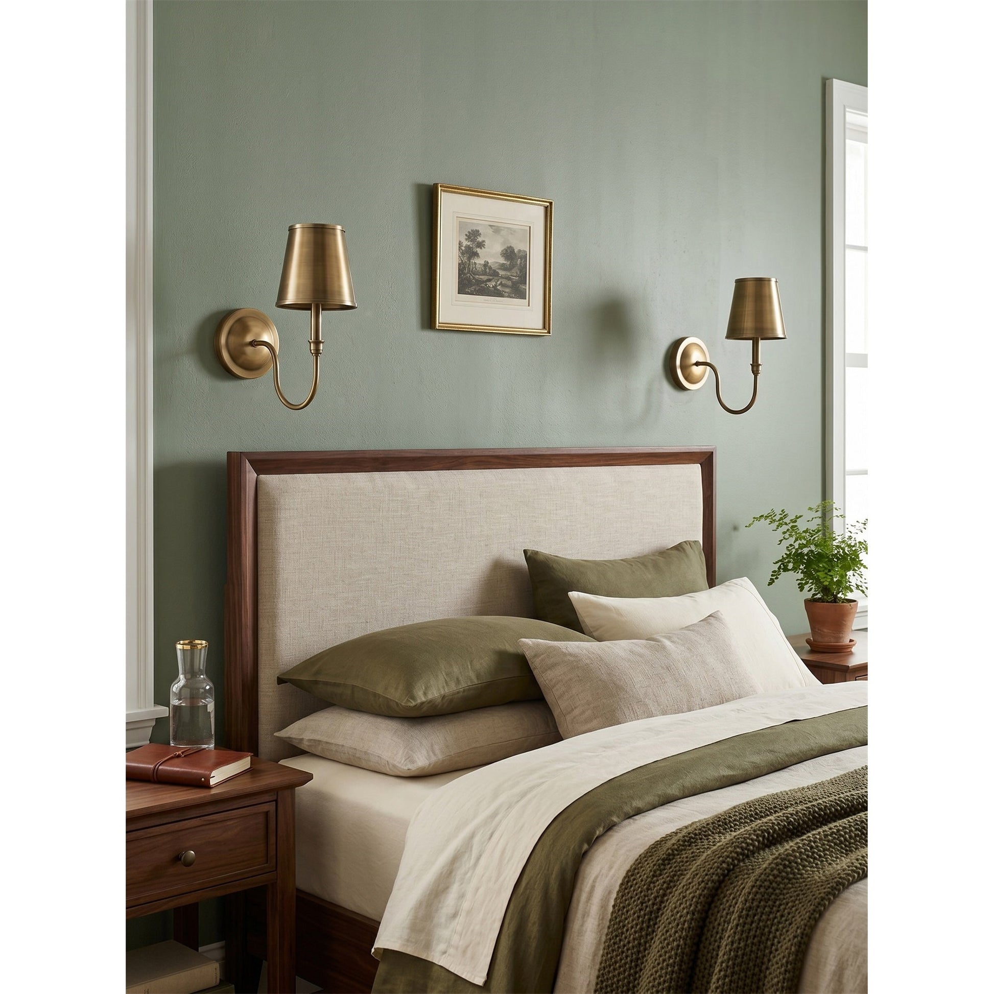 A pair of Alden Wall Sconces flanking a fireplace mantel.
