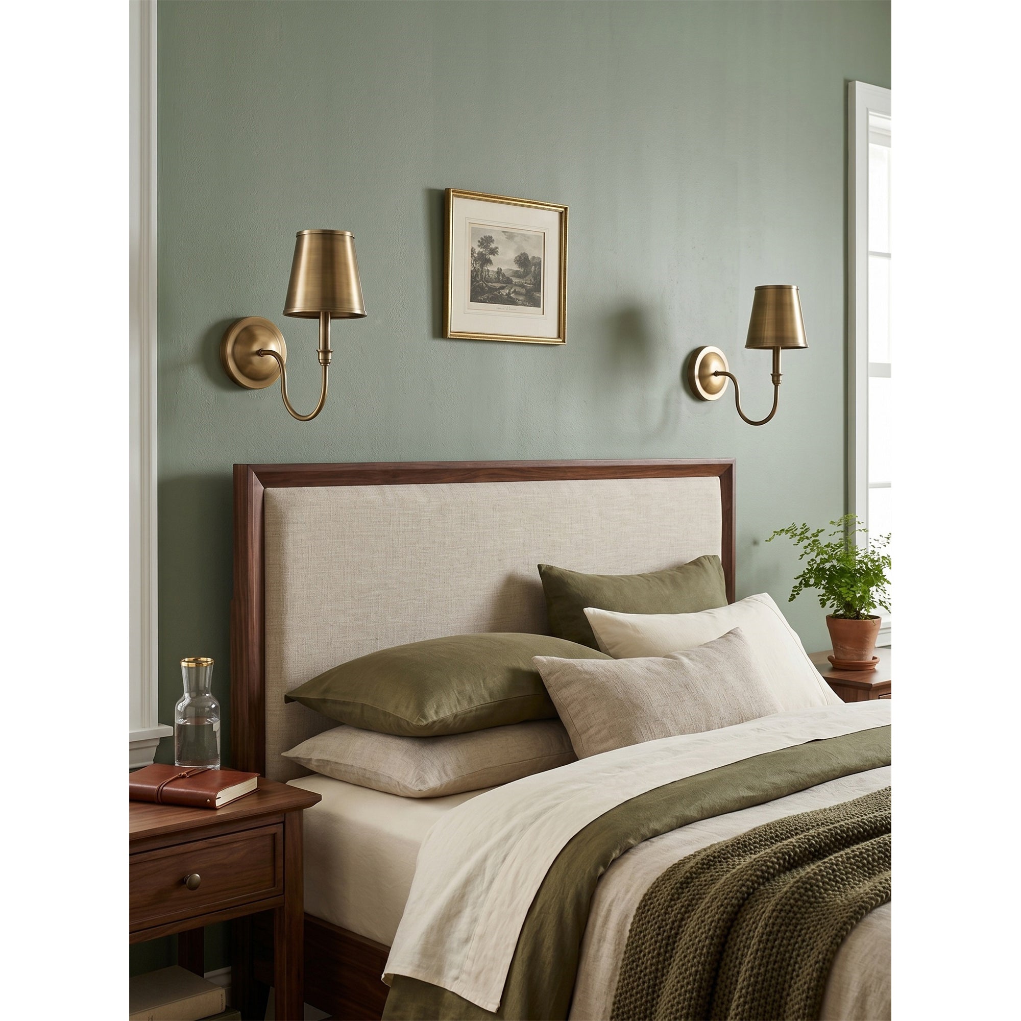 A pair of Alden Wall Sconces flanking a fireplace mantel.